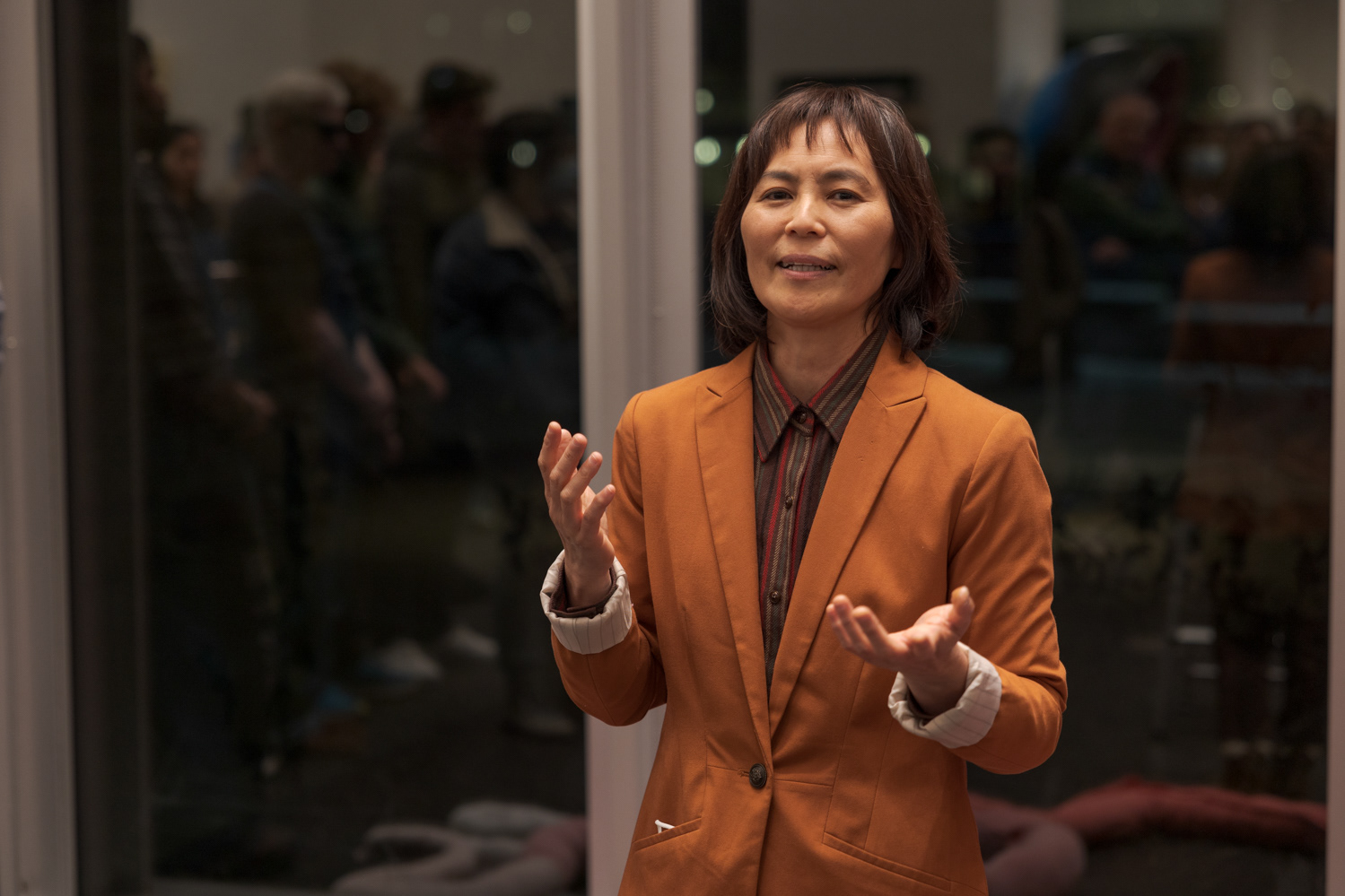 Mamiko Ikeda, a calligraphy artist, musician, and faculty member of the Art Students League of Denver, speaks about the process of judging entries to the Colorado State University Student Art Exhibition Nov. 29. "I really enjoy all the pieces in person finally," Ikeda said, "because it's really different. It's so different that I really enjoy looking at all the pieces here."