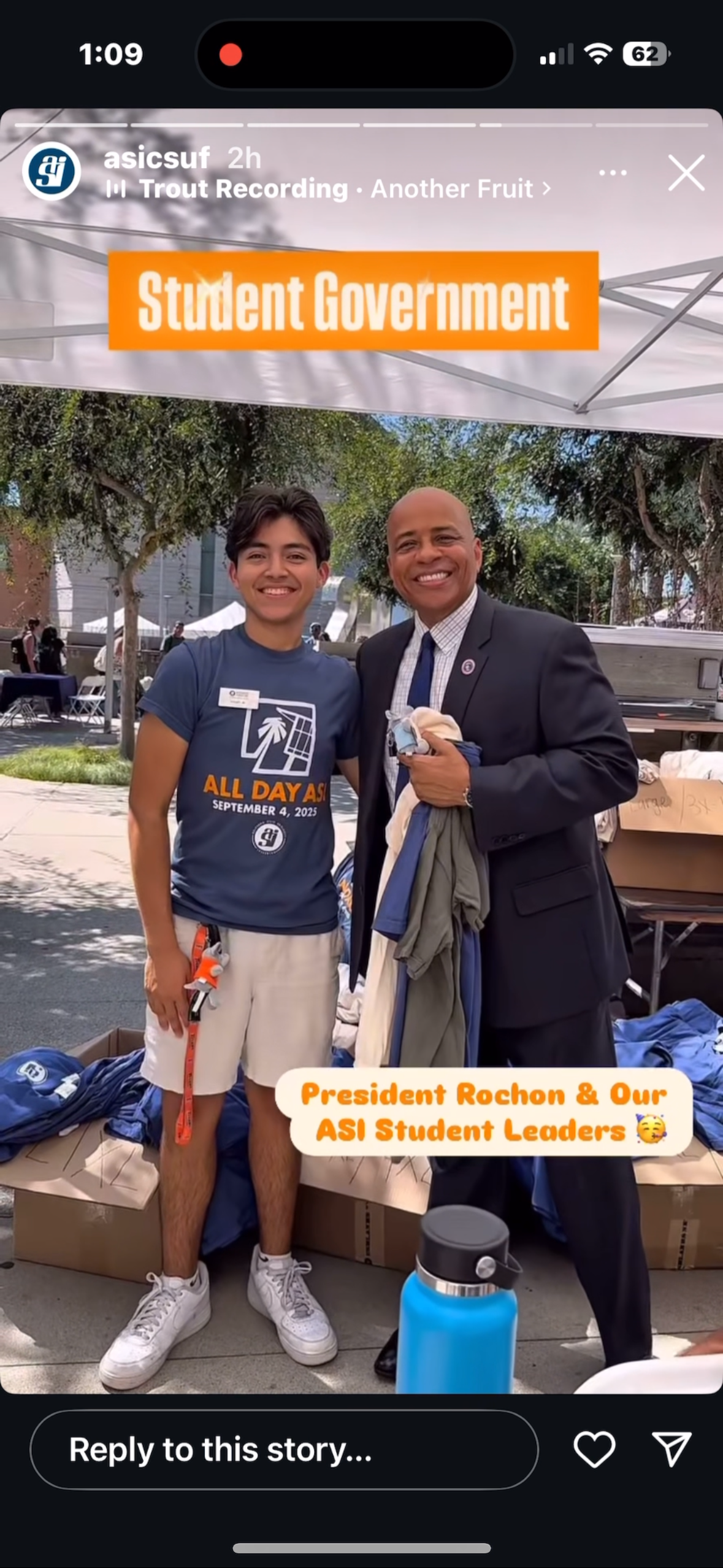 President of CSUF receiving T-shirt