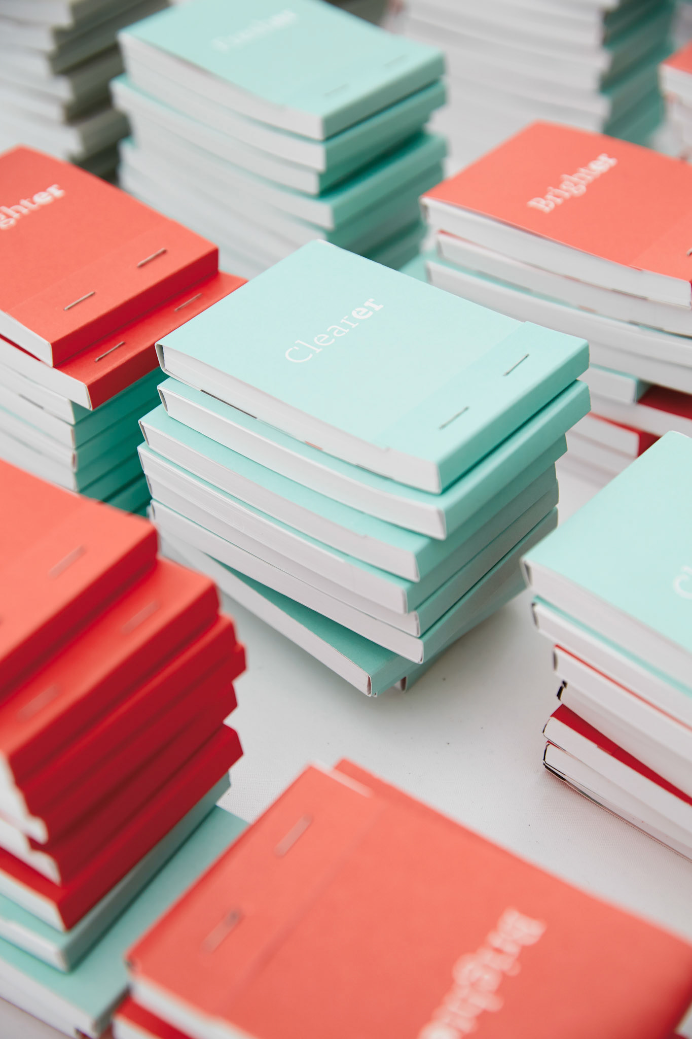 notepads arranged on table at the event