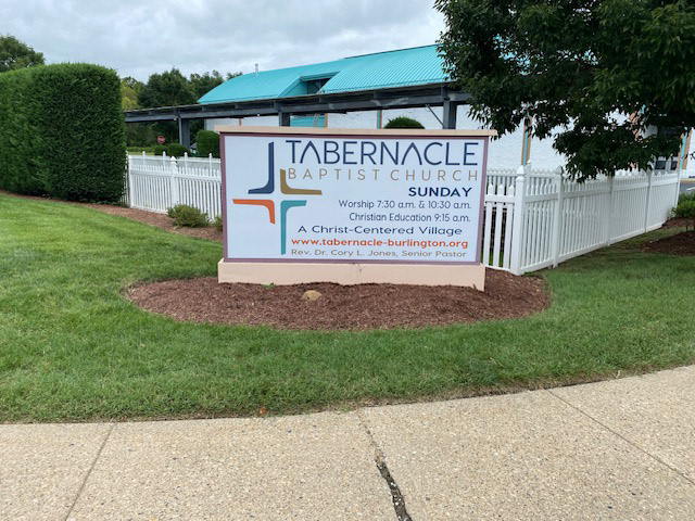 Exterior illuminated lightbox monument sign design for Tabernacle Baptist Church—combining modern brand mark hierarchy, translucent production specs, and clean roadside readability.