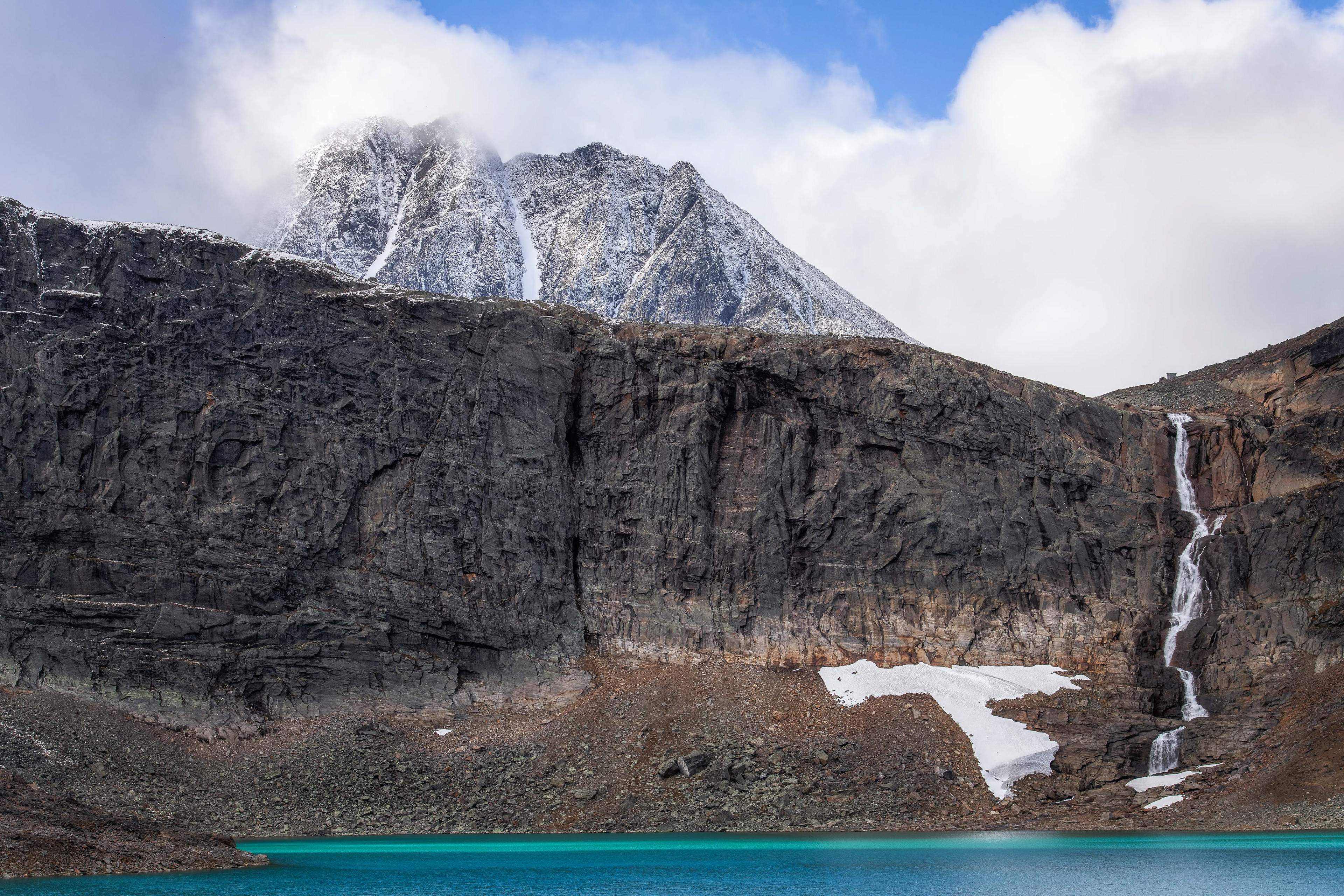 Unna Räittastugan on the right side above the waterfall