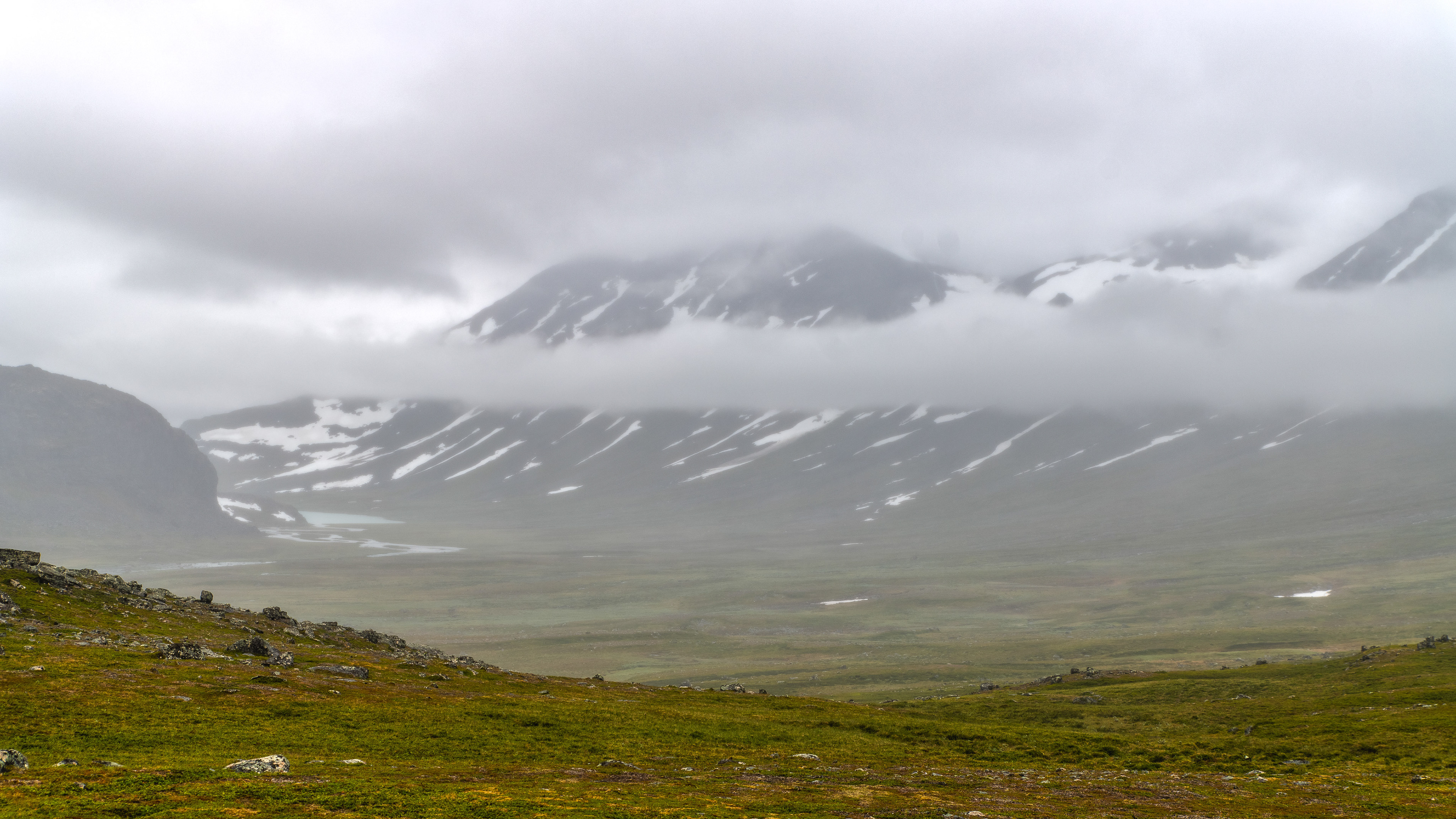 Cloudy morning in camp high above the valley leading to lake Bierikjávrre