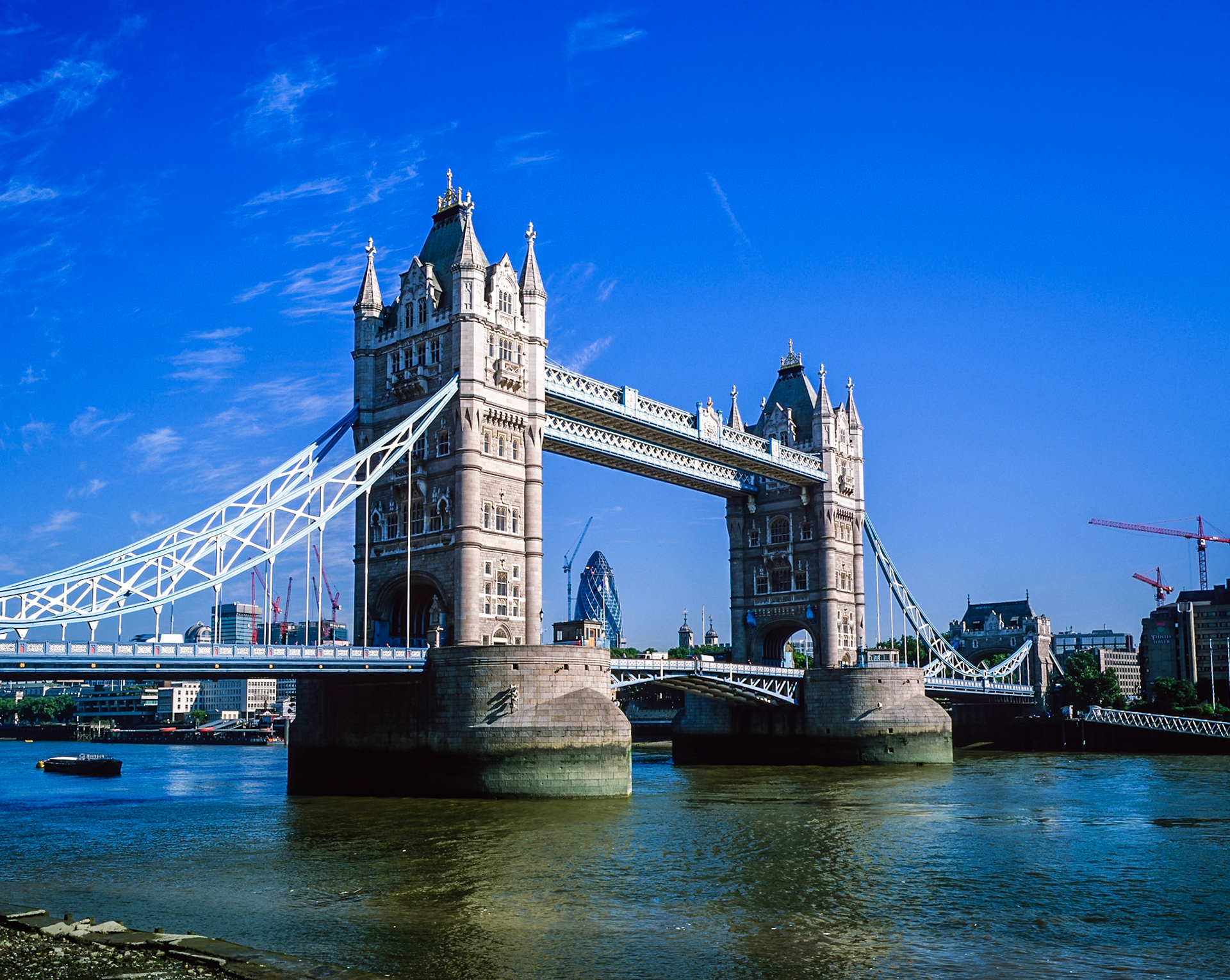 London, England - June 14, 2002: Tower Bridge in London, one of the most notable landmarks in London, over the River Thames, on a sunny day, in London, England