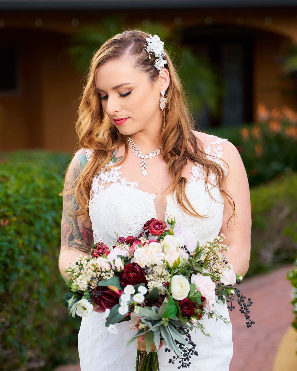 Bride in white dress holding a bouquet of flowers