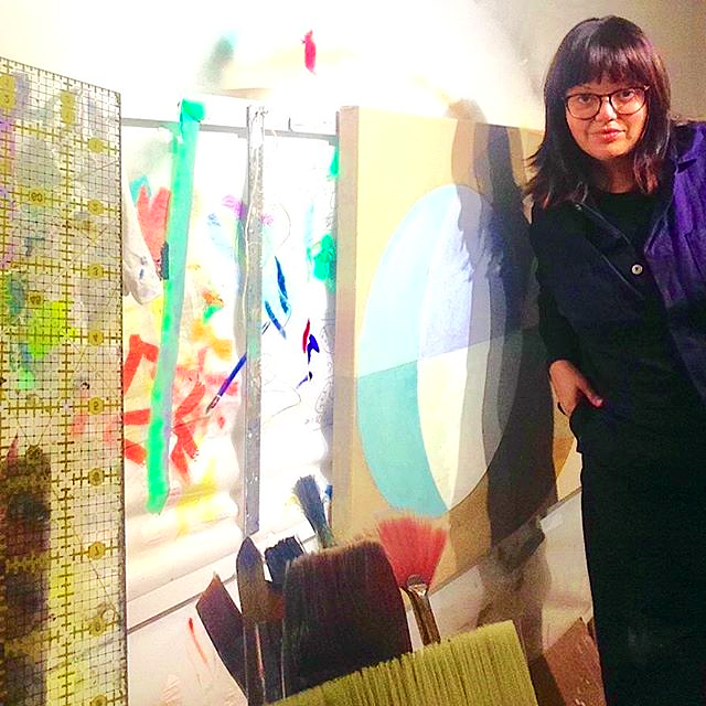 In the Studio, Toronto. Lori-Ann Bellissimo during the production of the Clear Intentions series. This view highlights the architectural scale of the 35 x 48 inch works and the rigorous, hands-on process of layering resin over Irish Linen.