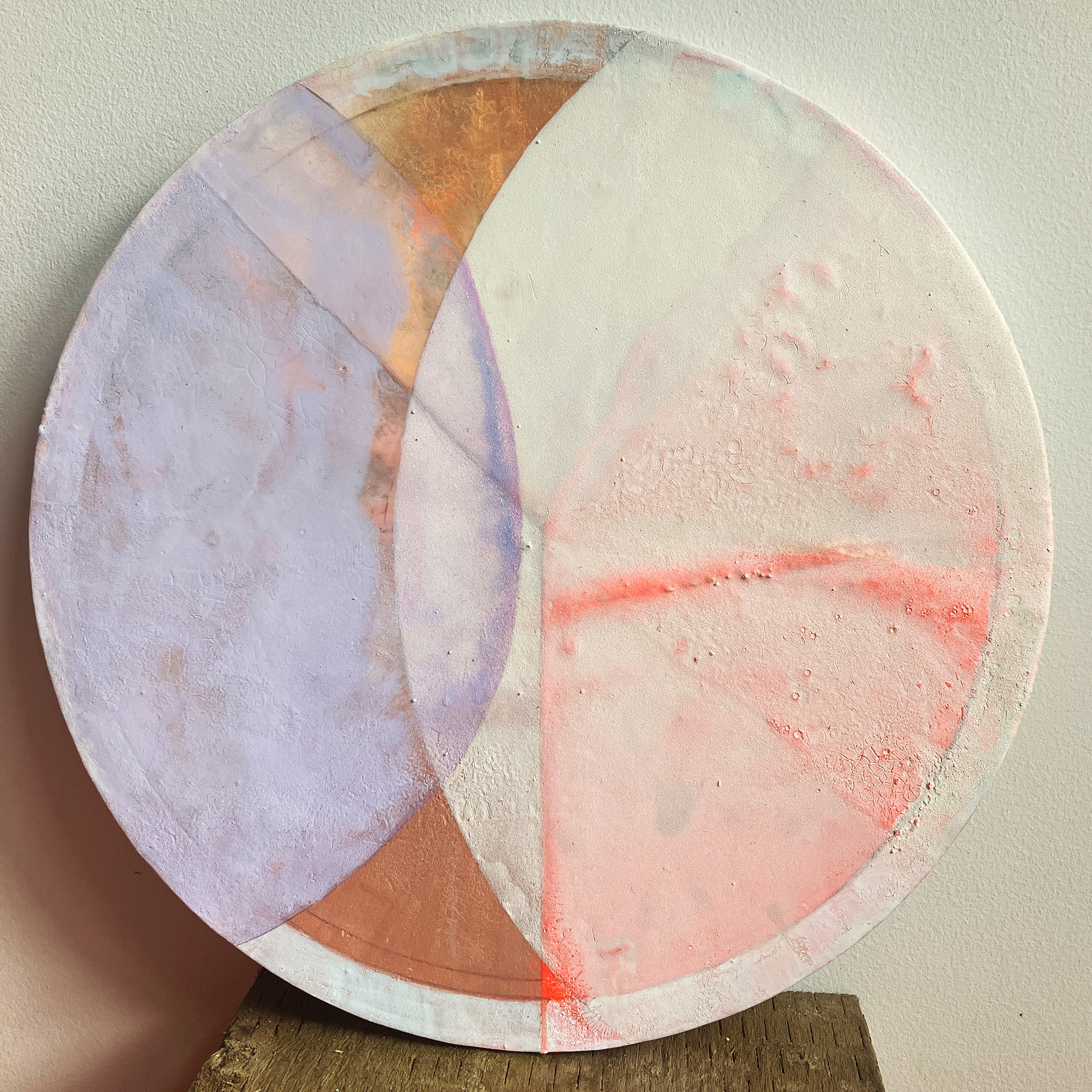 Spectral Drift: Horizon Veil, 2024. Watercolour, Acrylic Ink, and Silver Pigment on Paper. 32cm Diameter.A translation of pre-dawn gradients through a disciplined engagement with material. This work begins with documenting the horizon before building successive, delicate glazes on a rigid support. The application of silvered pigments creates a sense of "controlled chaos," mirroring the rhythmic complexity of a sunrise. By returning to the surface repeatedly, the transition from deep indigo to lavender is captured as a series of translucent veils, resulting in a surface that feels physically permanent yet visually weightless.