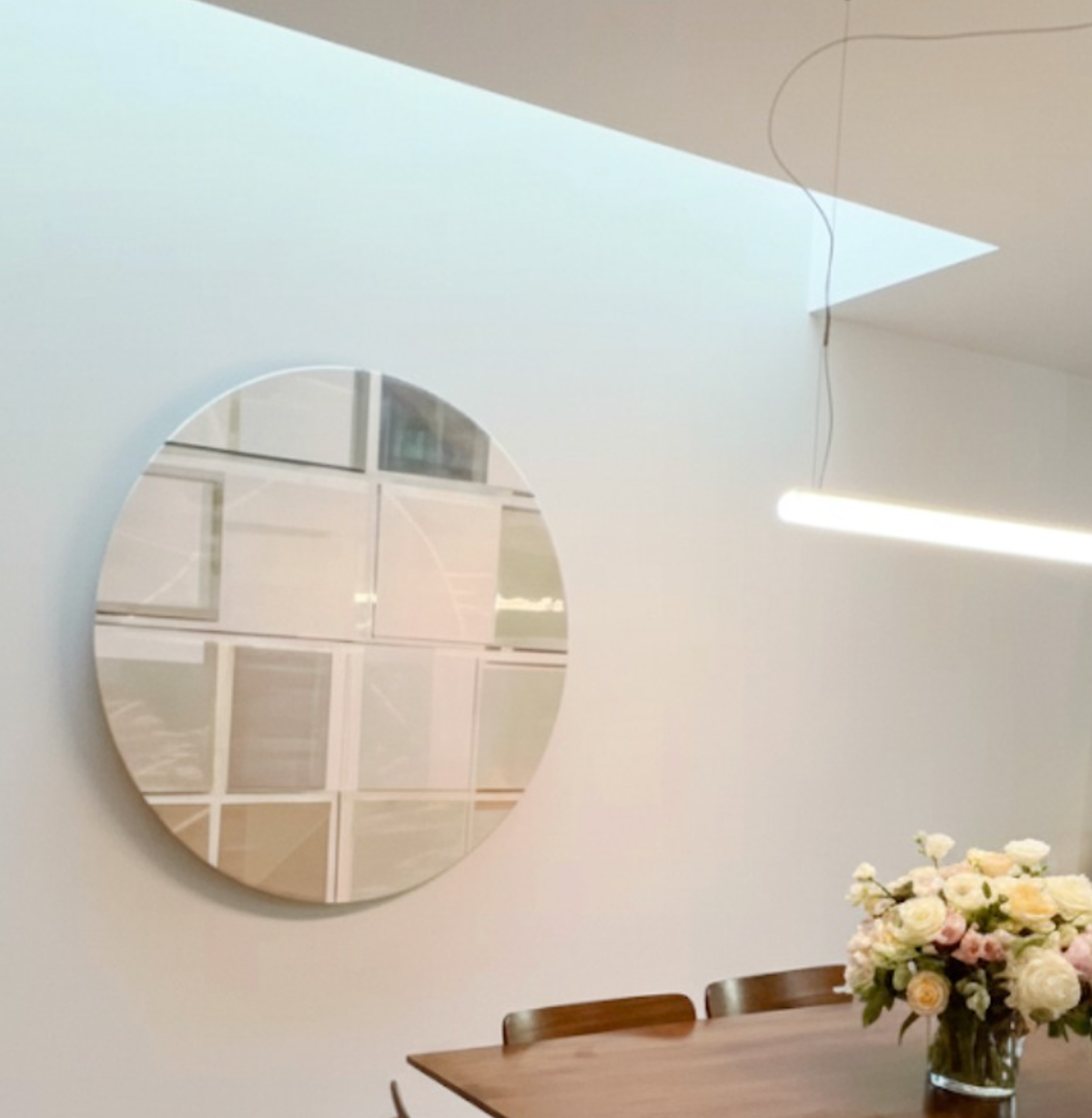 A translation of a digital "misfire." The grid-like discipline of Martin’s studio is reimagined through light-responsive glazes that shift with the viewer's movement.