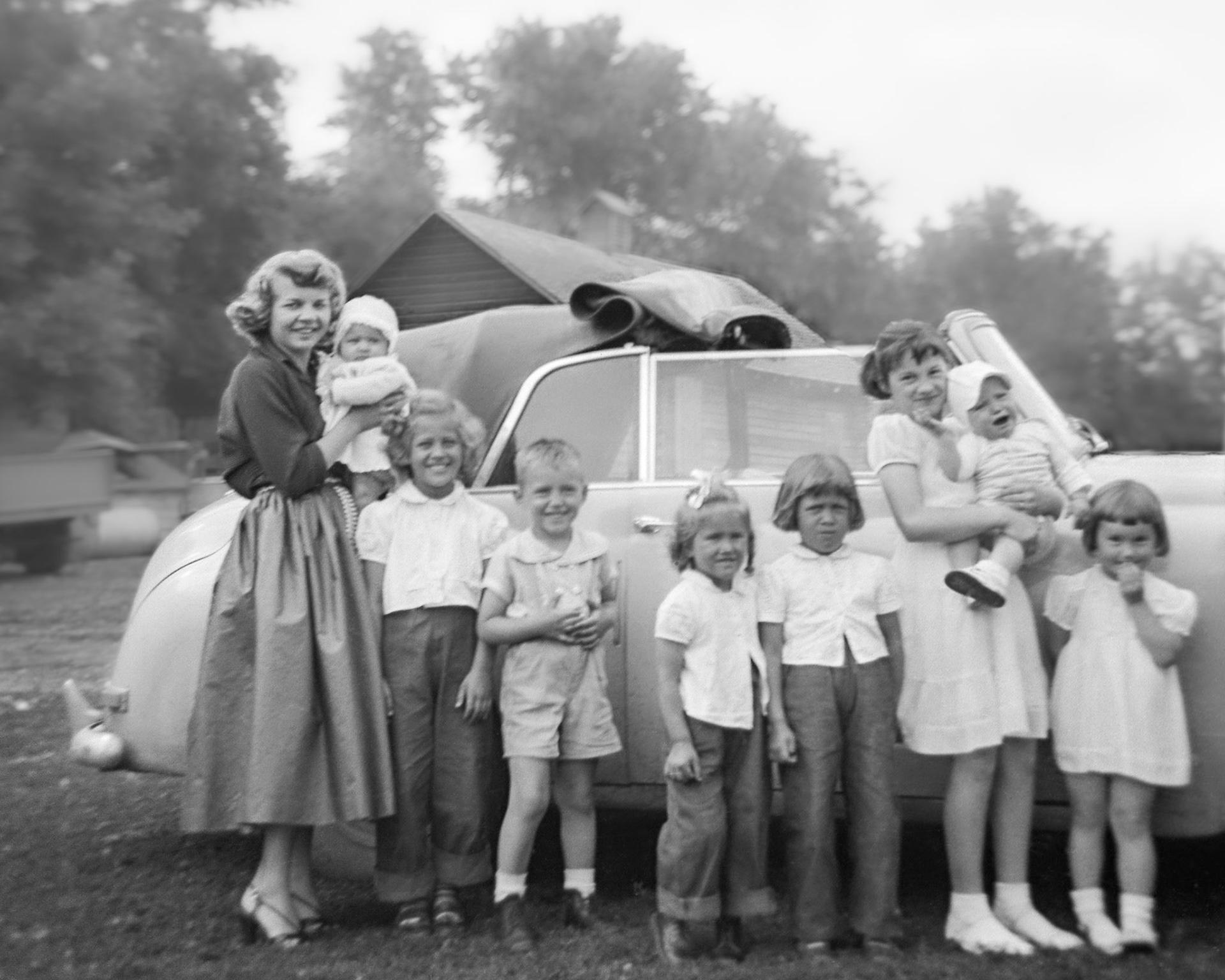 Circa 1954~56 • L to R: Vienna [Terho] Shewchuk  holding unknown infant (perhaps daughter Anita(1)) with nieces and nephew: Lorna Megley (9) - Donald Romanko (6) - Pat Megley (5) - Julia Megley (8) -  Evelyn Shewchuk (11) holding unknown infant - Elaine Shewchuk (5). Taken on Mike and Christina Shewchuk farm near Willingdon, Alberta.