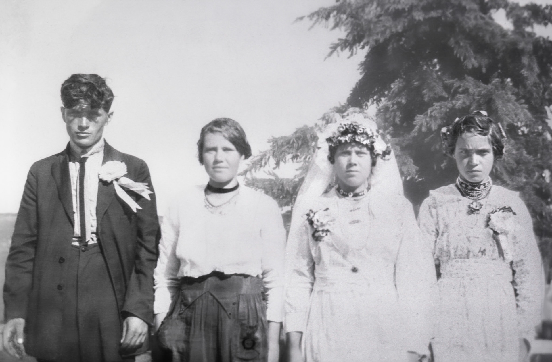 Wedding day 25 July 1920: Groom (Mike Shewchuk) not in this photo. L to R: ? male - female possibly sister of bride Magdelena (Mabel) Shewchuk - Bride: Christina [Huculak] Shewchuk - ? female.