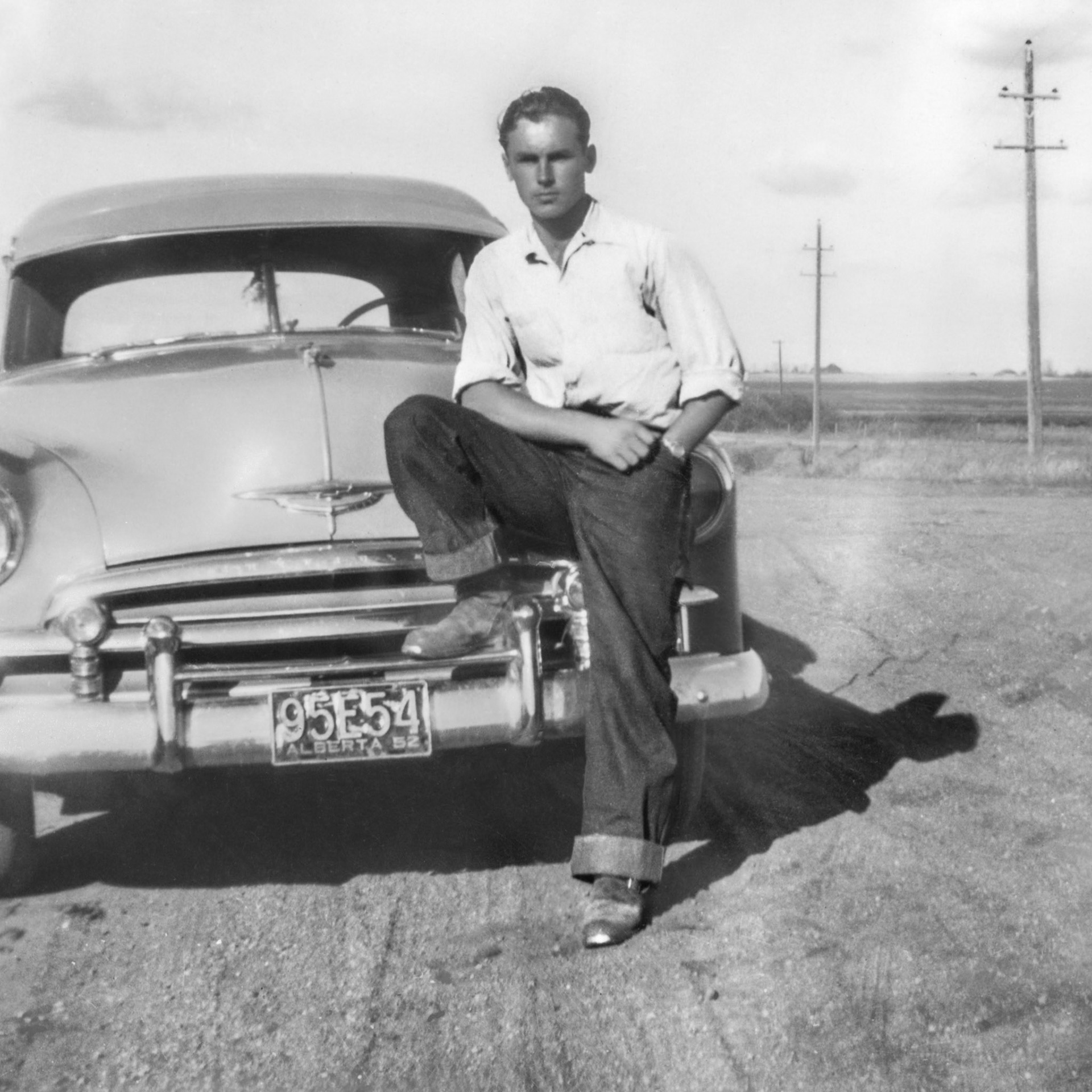 1952 (from vehicle license plate). George (Willis) Huculak. Likely location presumed to be Edmonton, AB or surrounding area.