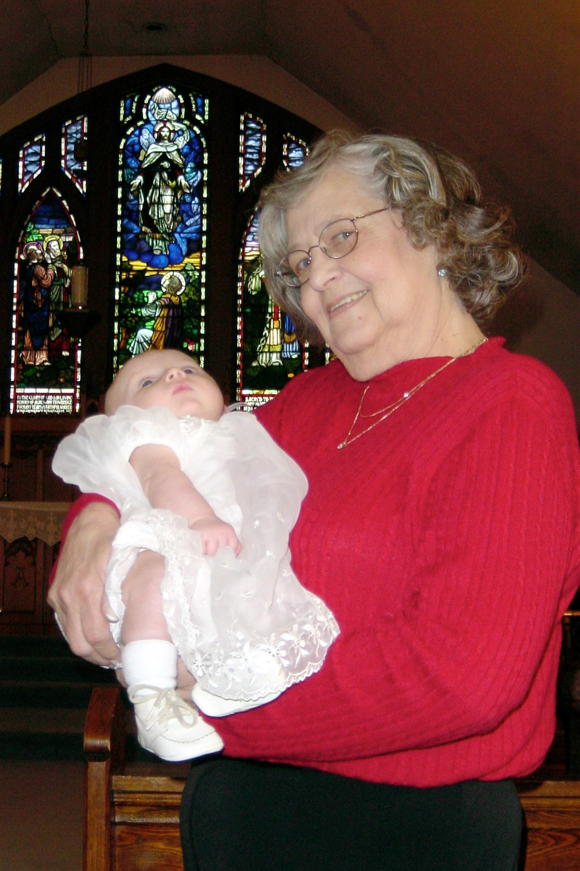 Jan 2003: Ottawa, Ontario. Grandmother and grandson. Kathleen [Shewchuk] Huculak at batism of grandson Ben Macki. Child of Dave Macki and Sherri [Huculak] Macki. Photo credit: Brian Huculak