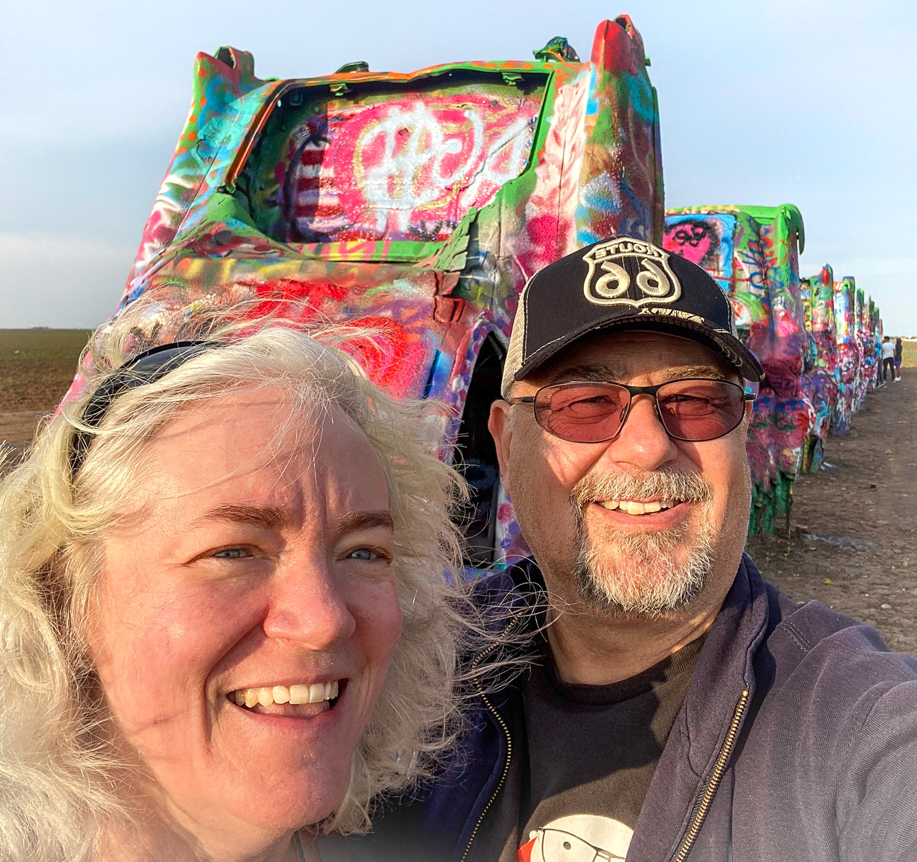 10 Oct 2022: Paula Rosson - Brian Huculak, at Cadalliac Ranch, Route 66, Amarillo, Texas. Photo credit: Brian Huculak