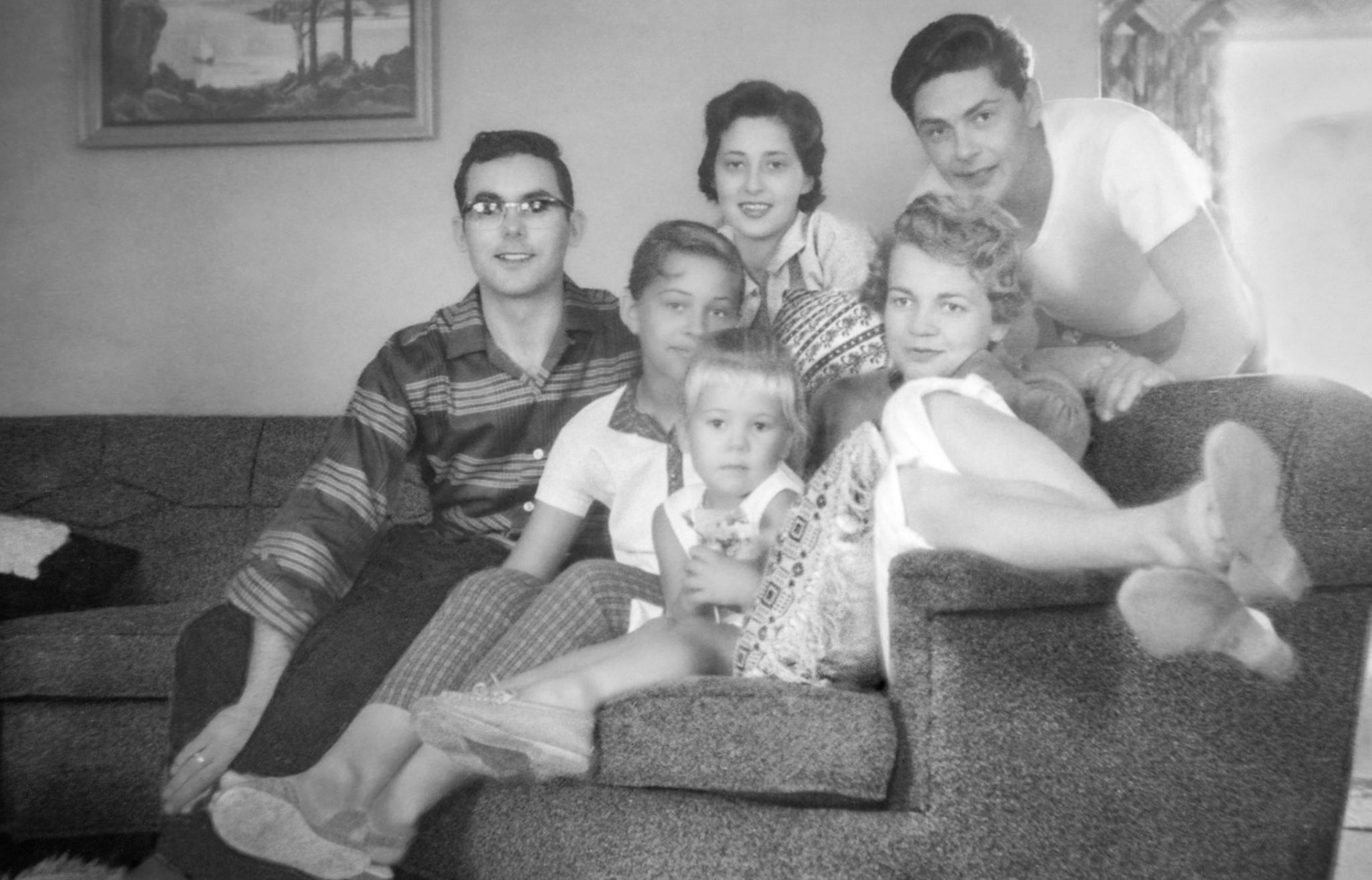 1958 • Behind sofa Kathleen [Shewchuk] Huculak (24) next to brother Paul Shewchuk (27). On sofa, L to R: John Huculak (25) - Lorna Megley - Anita Shewchuk (4) with mother Vienna [Terho] Shewchuk.
