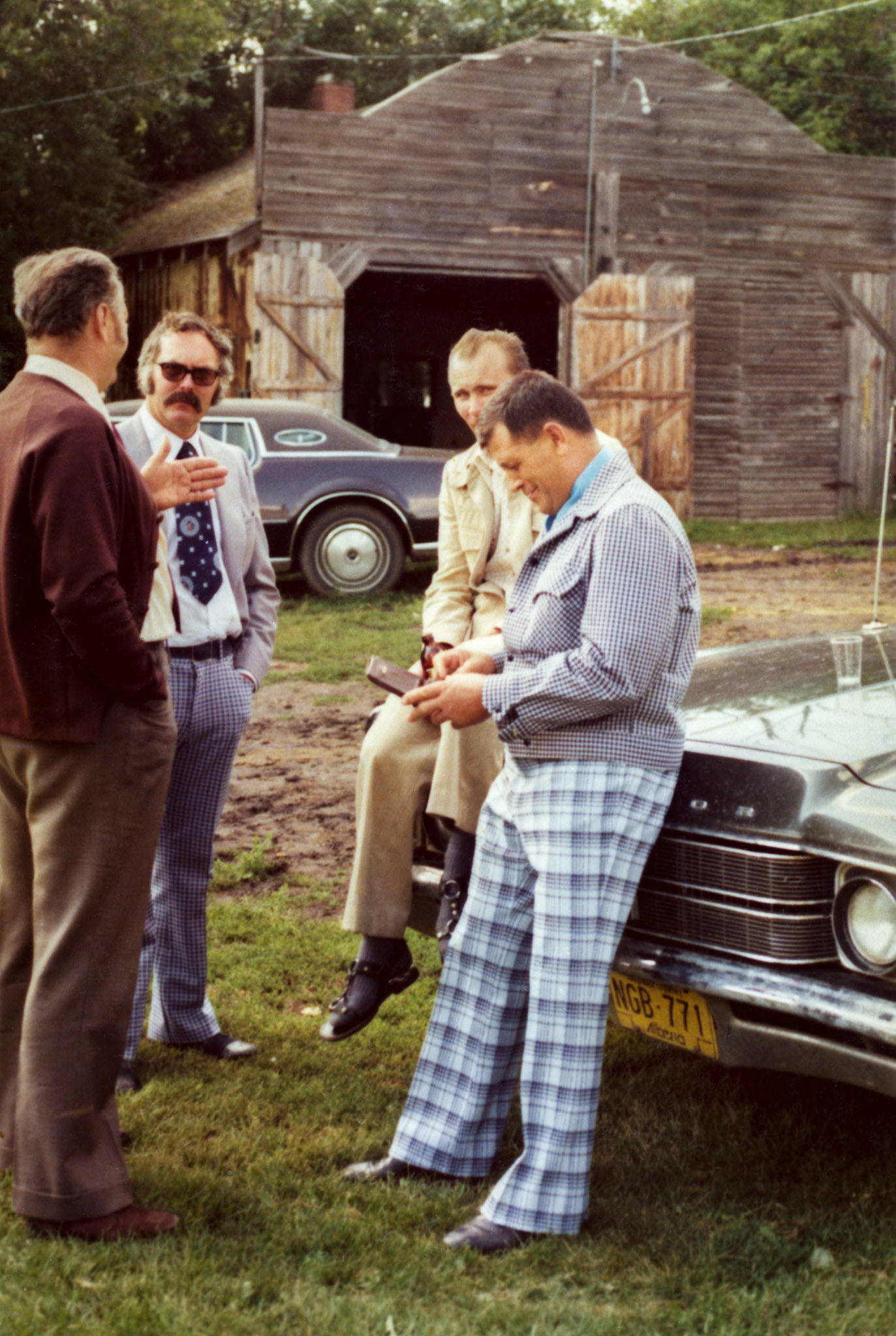 1976:  L to R: Metro Romanko (not facing camera). - John Huculak - Donald Stefaniuk - Metro Megley. Location: Mike Shewchuk homestead farm that was operated by John Tatarin and Lena [Shewchuk] Tatarin (daughter of Mike Shewchuk).