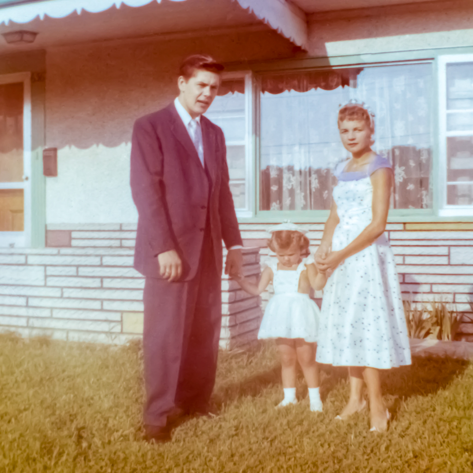 Circa 1958: Paul M Shewchuk and wife Vienna [Terho] Shewchuk with daughter Anita. In front if Vienna's sister's house in St. Catharies, ON.