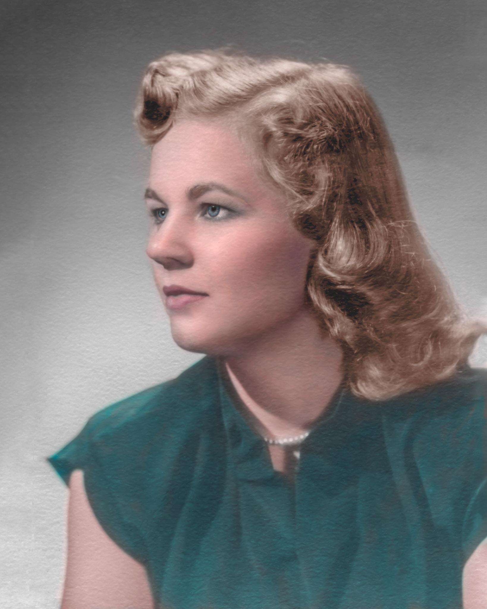 1952 • Vienna [Terho] Shewchuk, wife of Paula M Shewchuk. Restoration and colorization from original monochrome 2 1/4" x 3.5" scan by Brian Huculak. In addition to the usual dust, scratch, mold cleanup, this one needed reconstruction of background and part of the left arm and blouse added to suit traditional print sizes. Original textured paper retained authenticity.