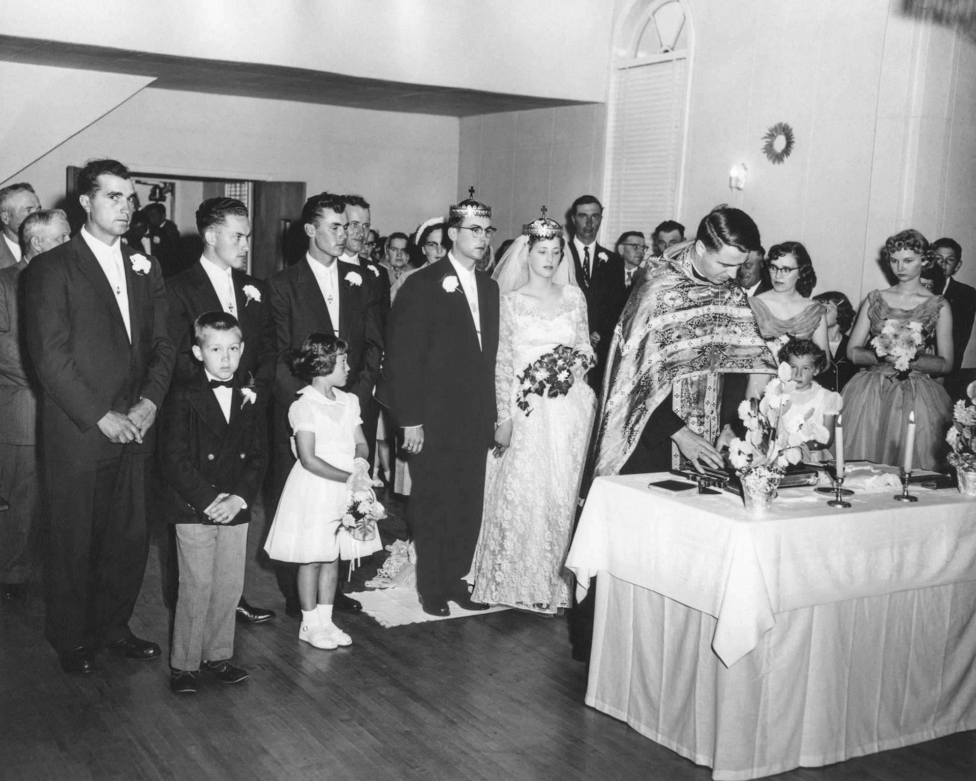 L to R: Don Romanko, Julia Megley, Nick Tatarin, Andy Garrick, George Huculak, John Huculak, Kathleen Shewchuk, George Kachuk and Lena [Shewchuk] Tatarin (background), Evelyn Shewchuk, Julia Kocak, Pat Proniuk, Robben Shewchuk. Foreground Rev Dmytro Luchak