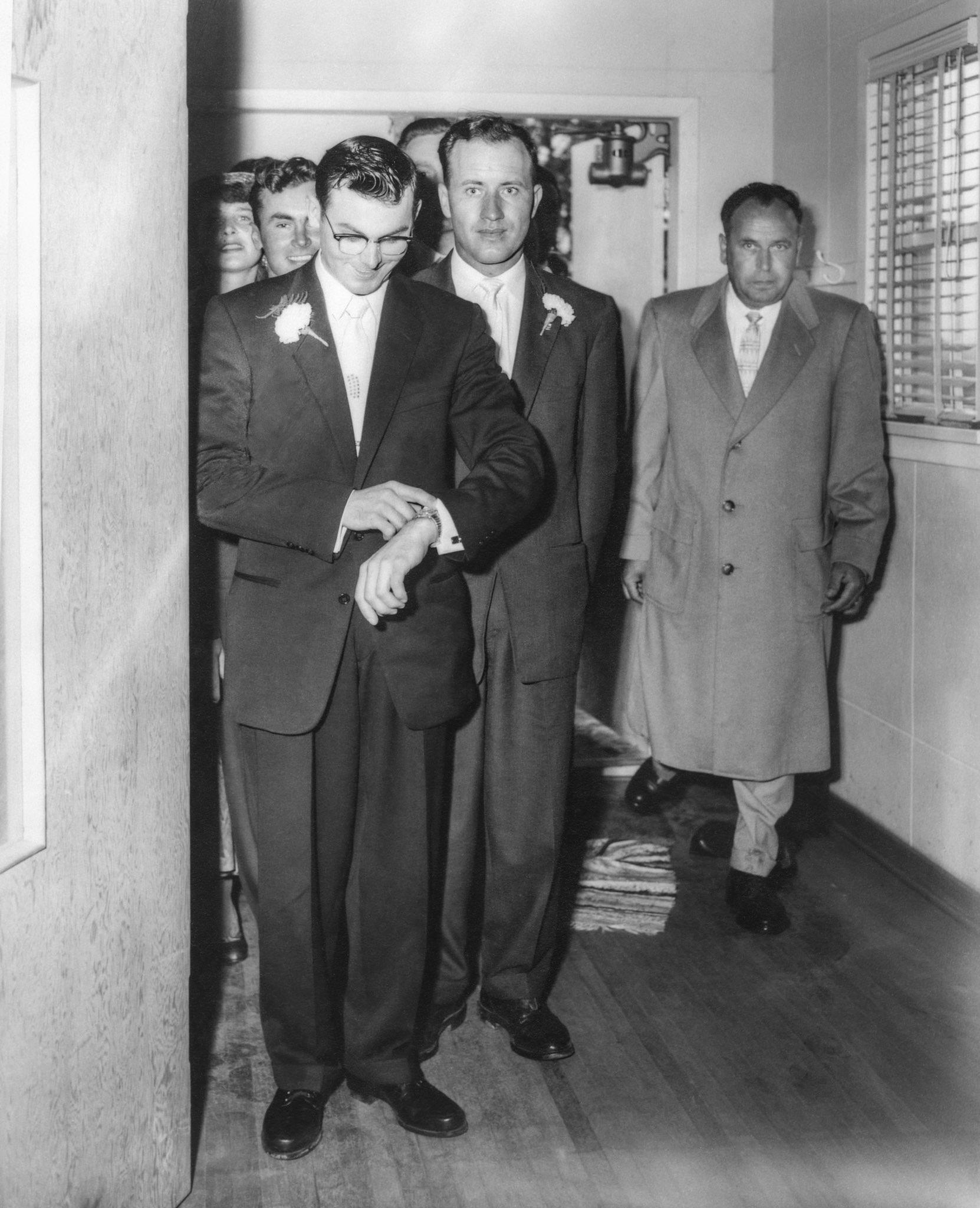 John Huculak, groom front left checking his watch to see if Kathleen will arrive on time :-D George Kachuk, best man, immediately behind John. George Huculak peeking behind his brothers right shoulder.