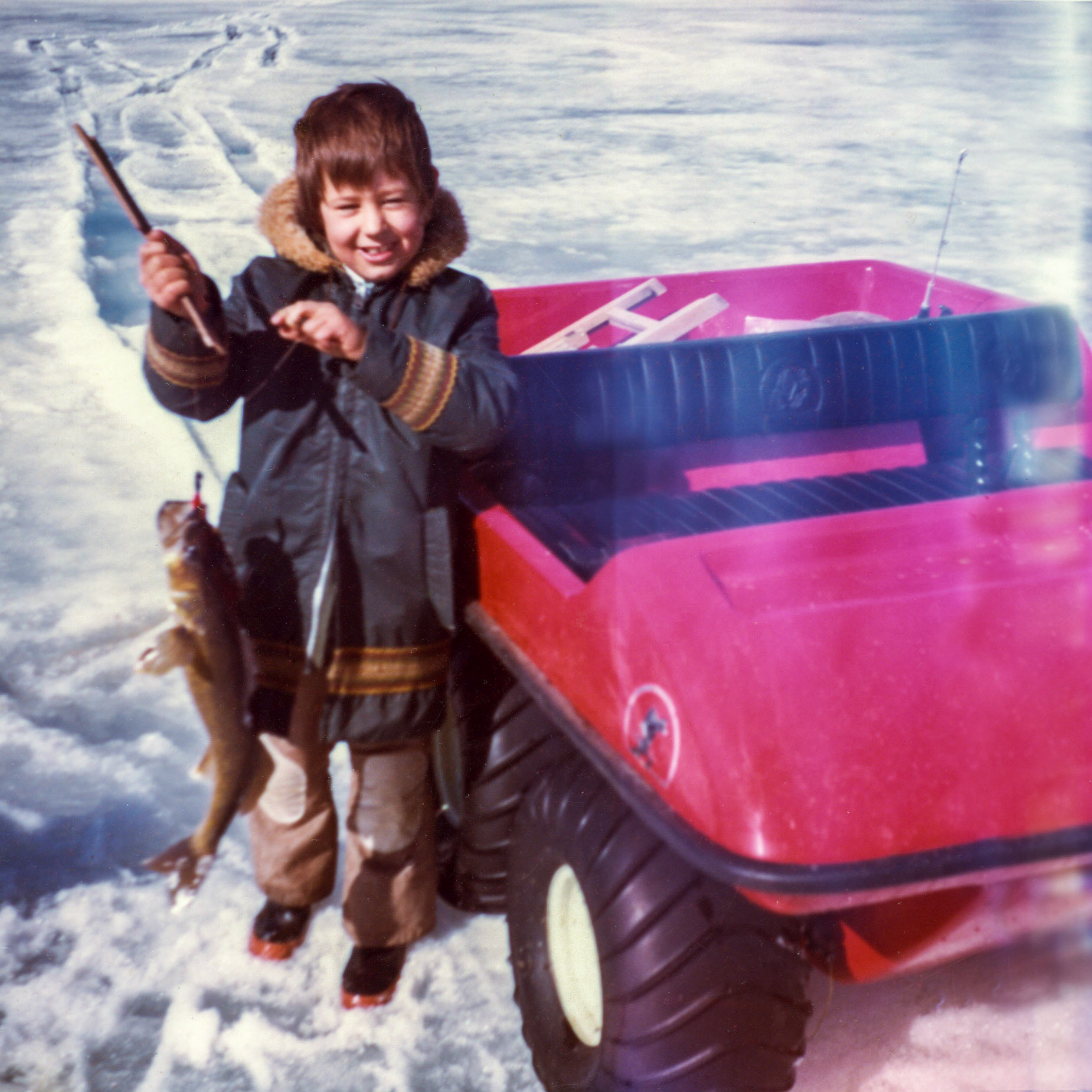 Spring 1972 • Brian Huculak (8) showing the boys how to land the big fish on one of the lakes in north central Alberta. Photo Credit: John Huculak (father).