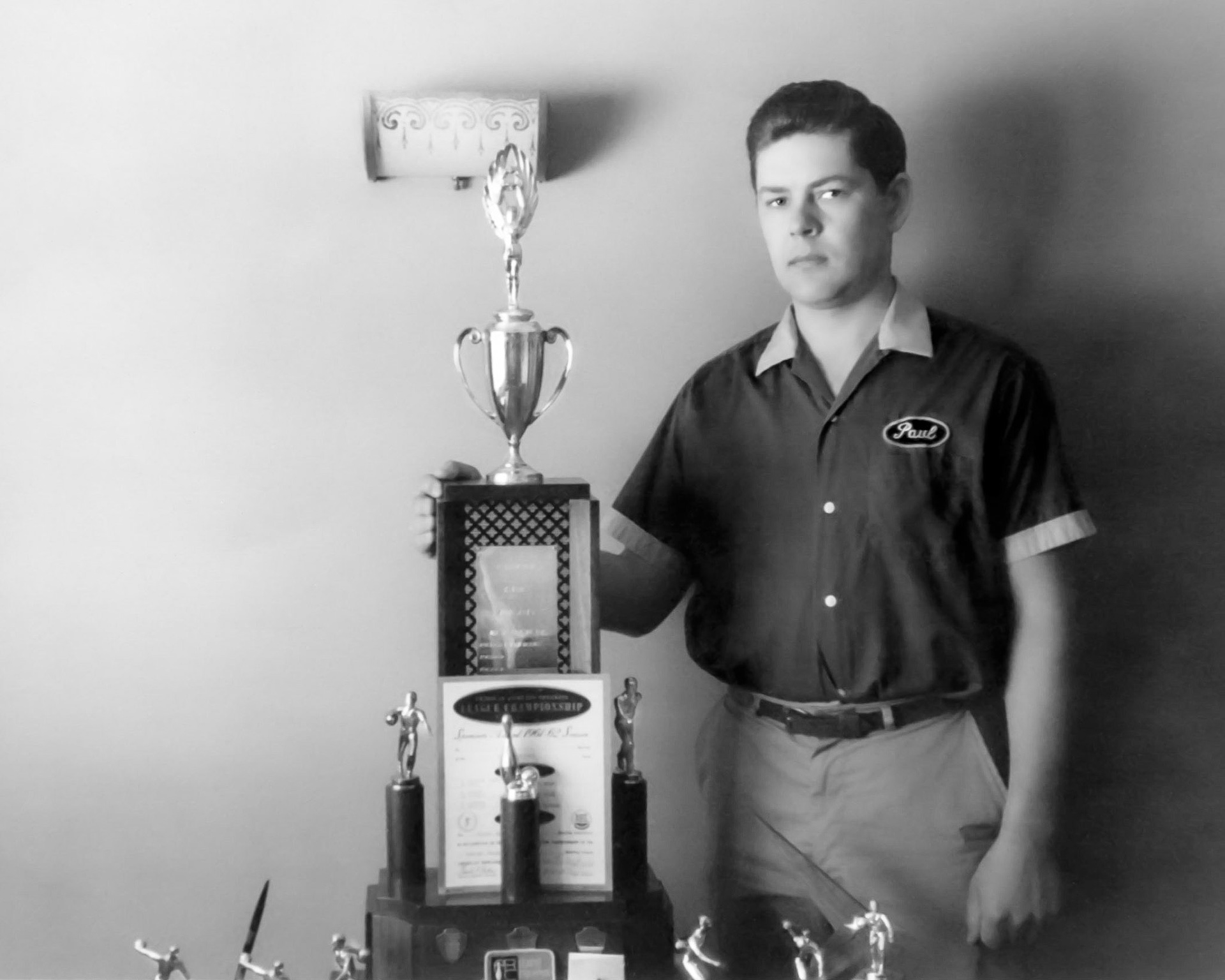 Paula Shewchuk wth campionship bowling trophy from 1961-62 season.