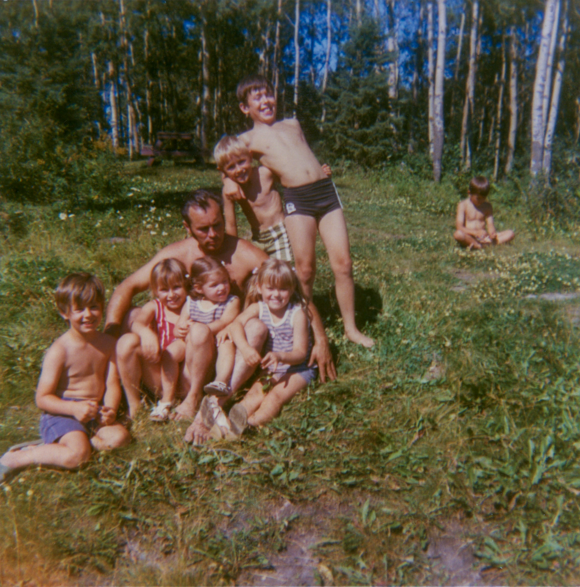 Circa 1972: Grandkids of John N Huculak: Adult: George Huculak. Ken, Wayne (standing behind). Front L to R: Brian, Kelly, Sherri, Lee-Ann (sitting), Trevor (background).