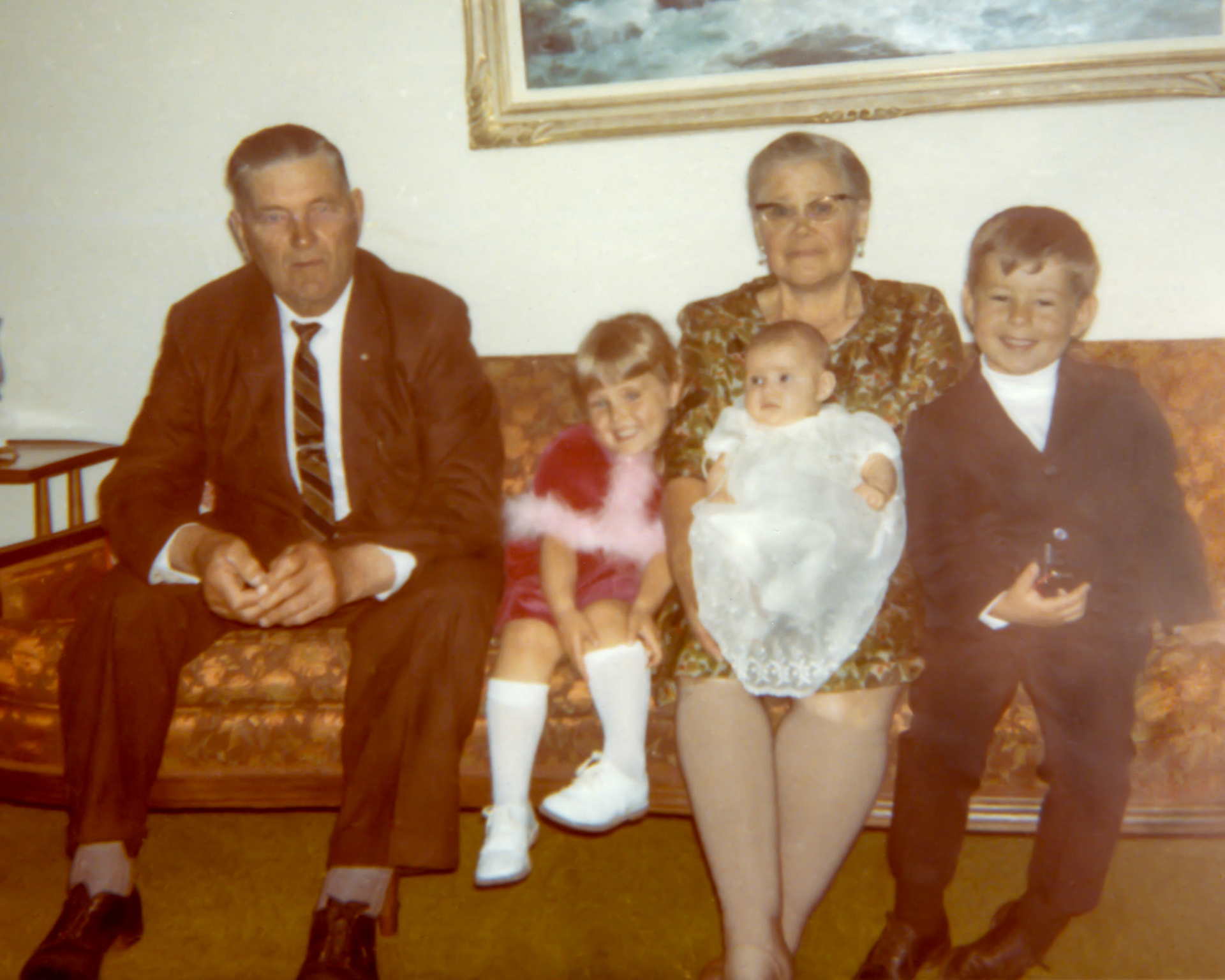 July 1969 • L to R: grandfather Michael Shewchuk (father of Kathleen [Shewchuk] Huculak) - Lee-Ann Huculak - grandmother Christina [Huculak] Shewchuk (no Huculak relation) - Sherri Huculak (infant in baptism gown) - Brian Huculak. Location: family hone of John and Katheen Huculak, Edmonton, Alberta. Photo credit: likely John or Kathleen Huculak