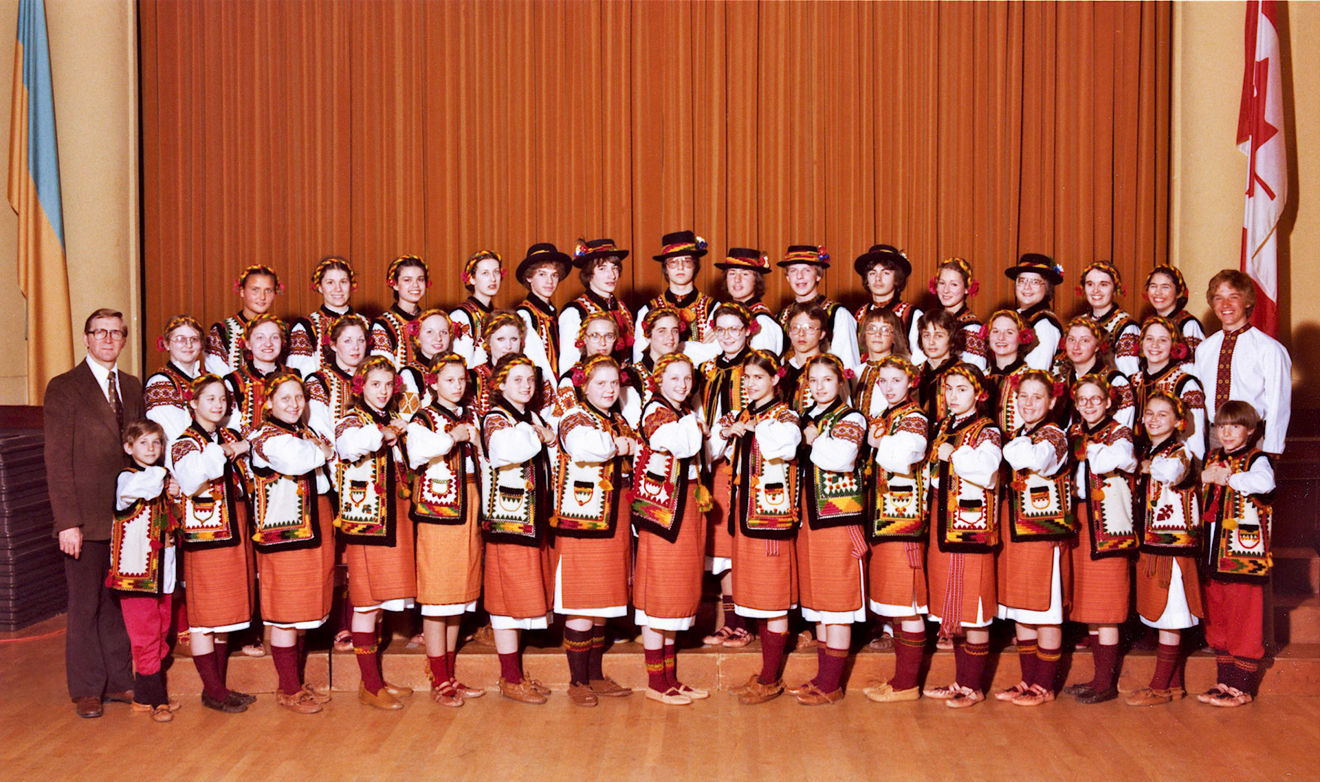 Circa 1978 •  Brian and Lee-Ann Huculak with their Ukrainian dance group, Edmonton, Alberta. Brian in back row right center, Lee-Ann front row 4th from right. Children of John Huculak and Kathleen [Shewchuk] Huculak. Chester Kuc far left standing, founder of Cheremosh Ukrainian Dance Company. Photo Credit: Jerry Pryma, Academy Photo Studio Ltd, 10875-97 Street, Edmonton, Alberta, T5H 2M5