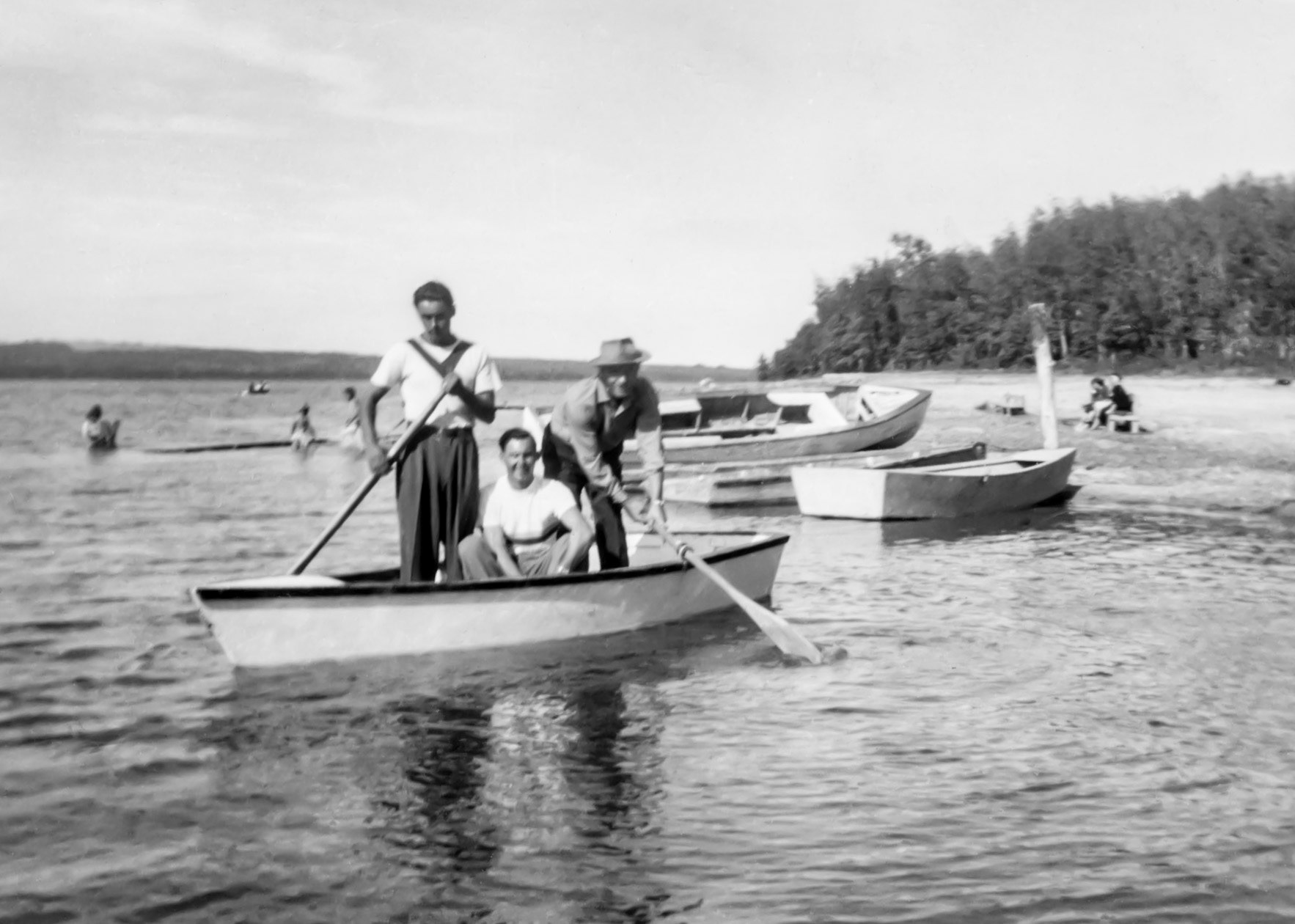 1952: George (Willis) and brother John Huculak and George Katchuk standing right. Scan fronm 3x5 inch BW print and image restoration by Brian Huculak. Location unknown. Possibly Sandy Lake near Willingdon, AB.
