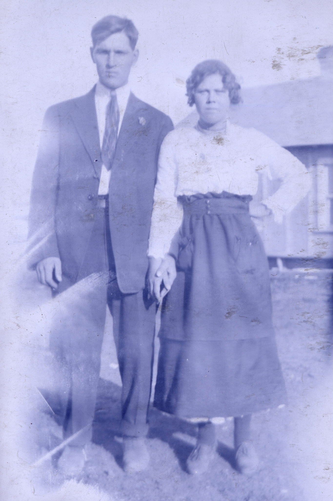 BEFORE: Mike Shewchuk and Christina [Huculak] Shewchuk. Taken on or near wedding day of 25 July 1920. Scan from 4x6 BW film negative.