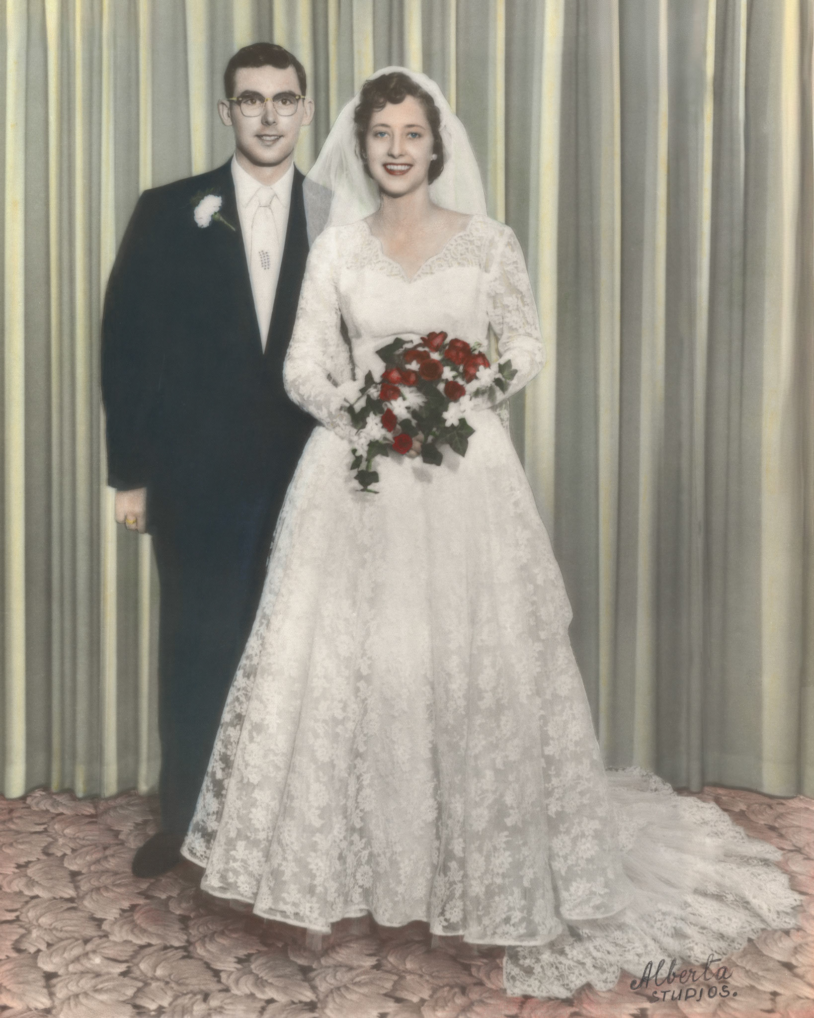 Black and White wedding photo hand painted color by unknown artist from Alberta Studios. Original size 10x13 inches. Cropped here to 8x10 aspect ratio. Colors have not been restored or altered from scanned original