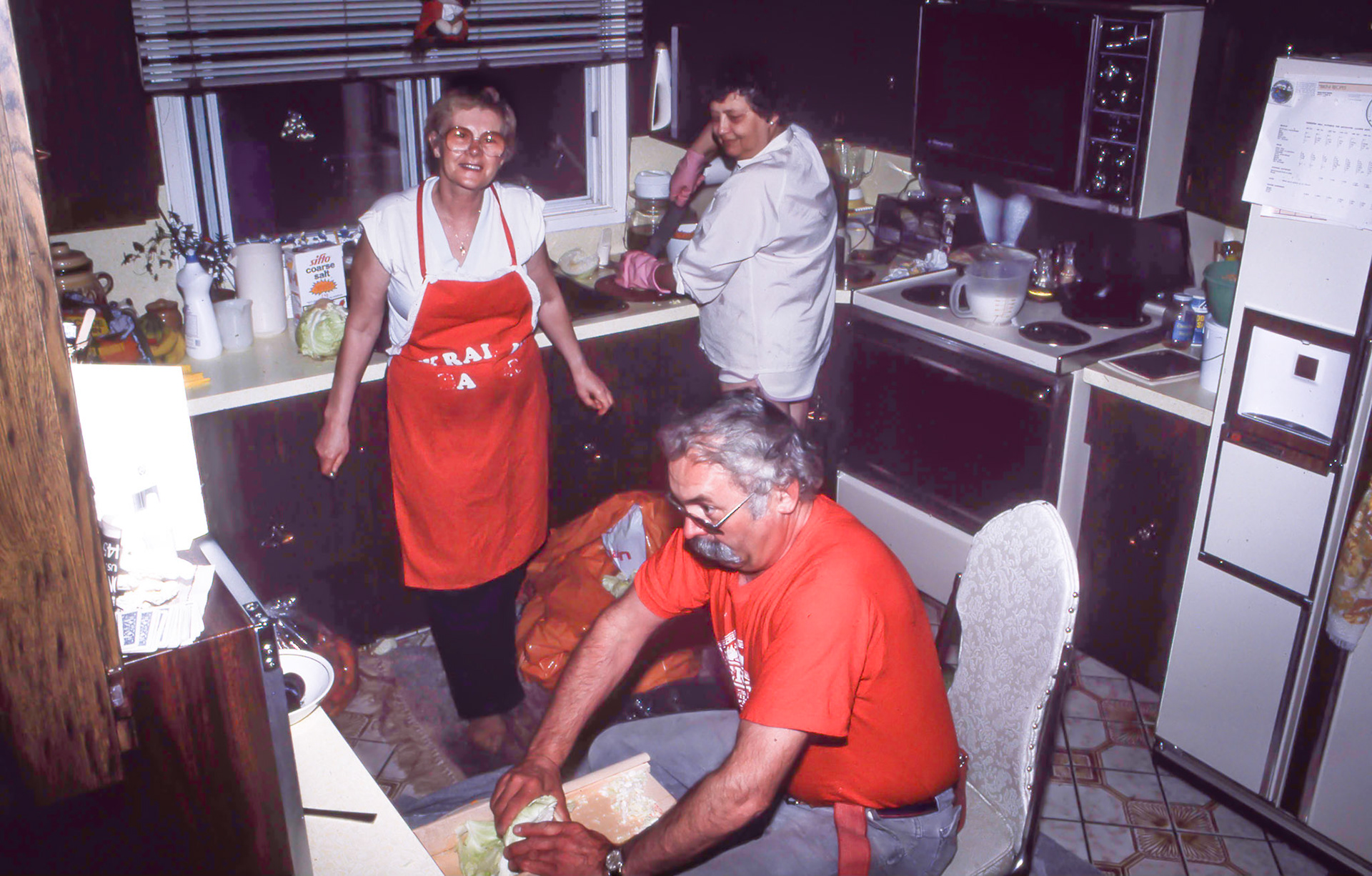 Circa 1980 • John Huculak, (bottom) - sister Doris [Huculak] Davie (centre) - Kathleen [Shewchuk] Huculak (back right). Making sour cabbage at John and Kathleen’s home in Crestwood, Edmonton, AB. Photo credit  Brian M Huculak
