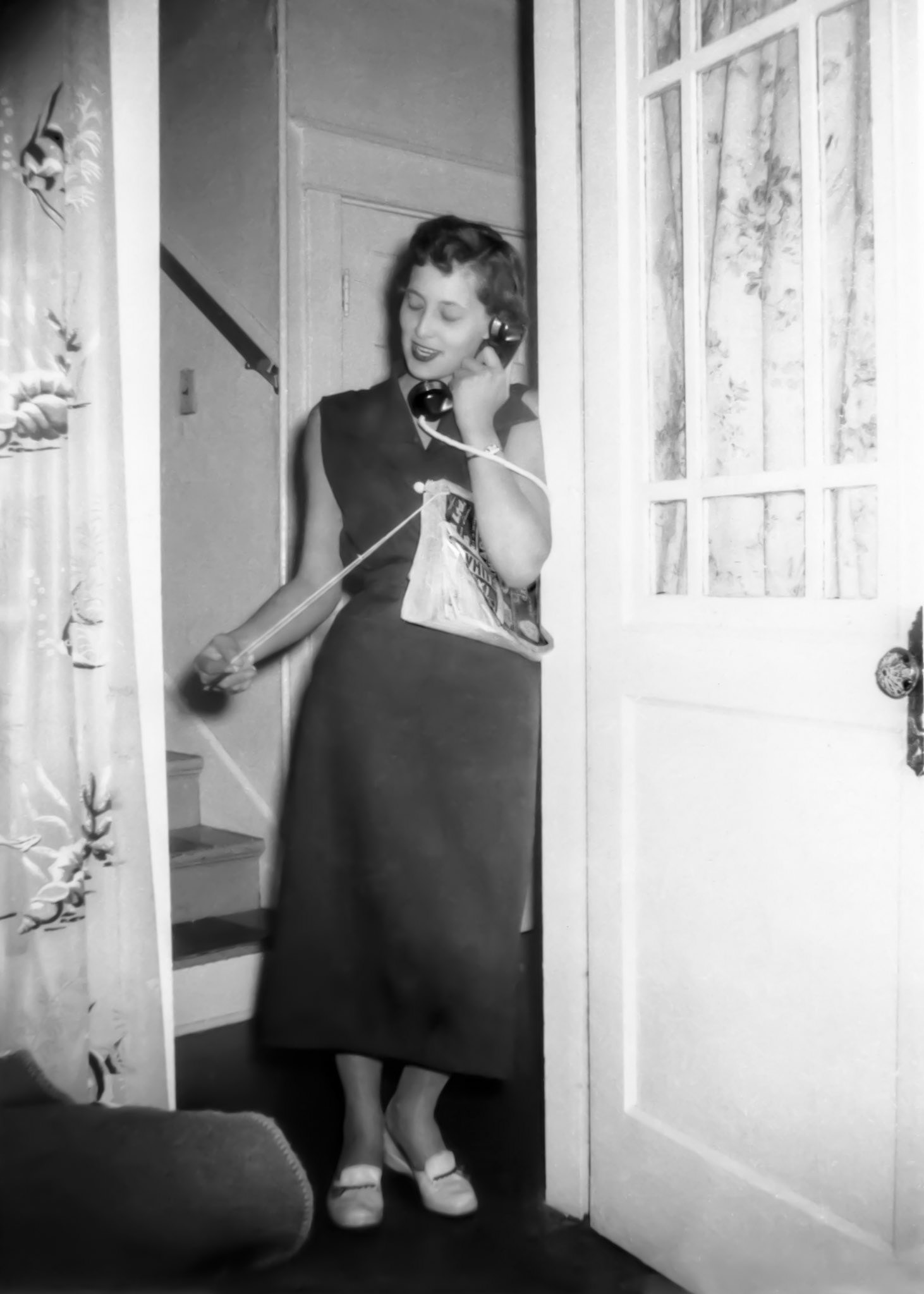 1955 • Kathleen Shewchuk looking stylish on the phone in Edmonton, AB.