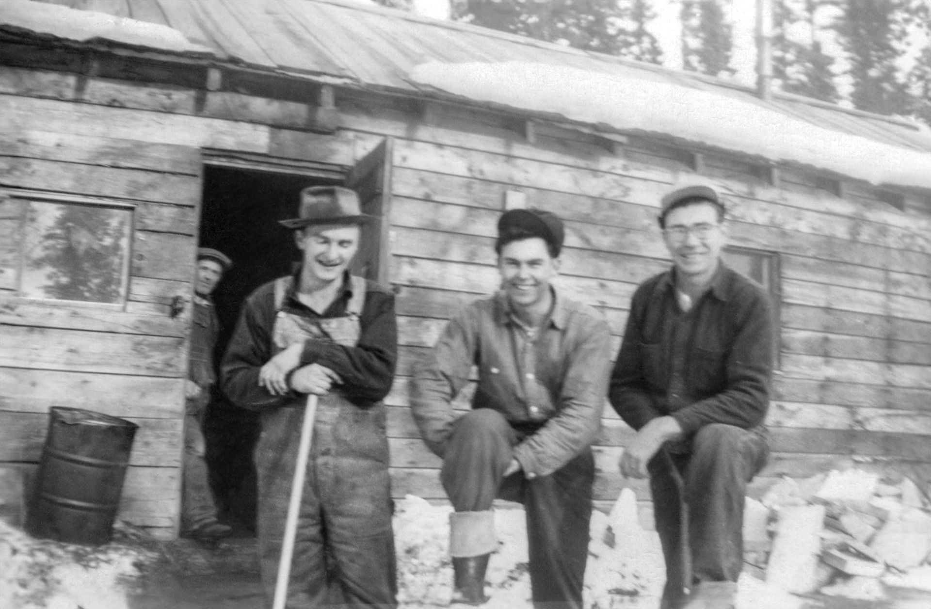 Circa 1949: John Huculak (center) British Columbia logging camp(age 16).