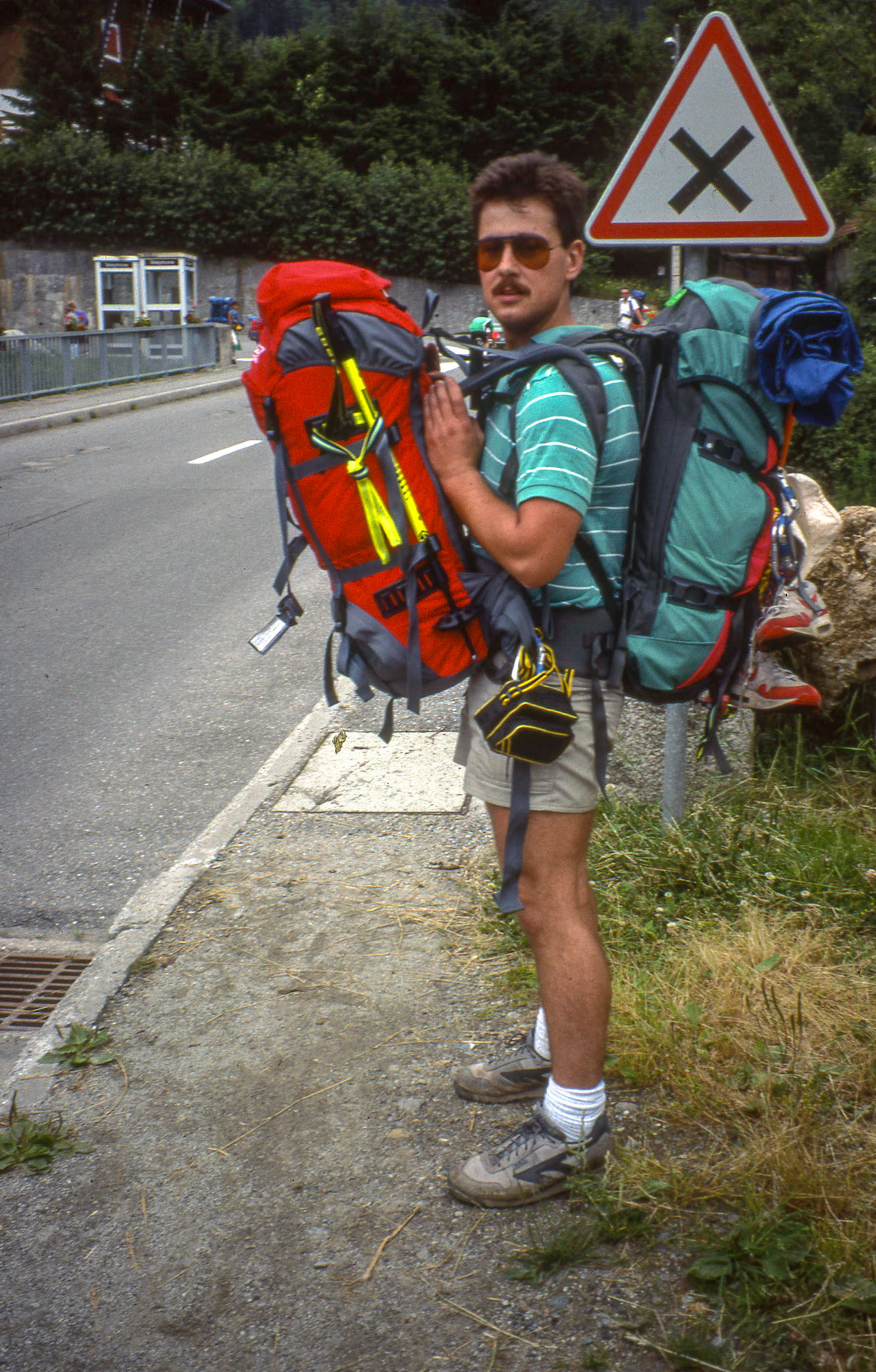 Early 1990's: somewhere in Europe hiking around Mt. Blanc (France, Italy, Switzerland). Brian Huculak helping out a friend on the last few miles of a long day. Photo credit: Robert Keith.