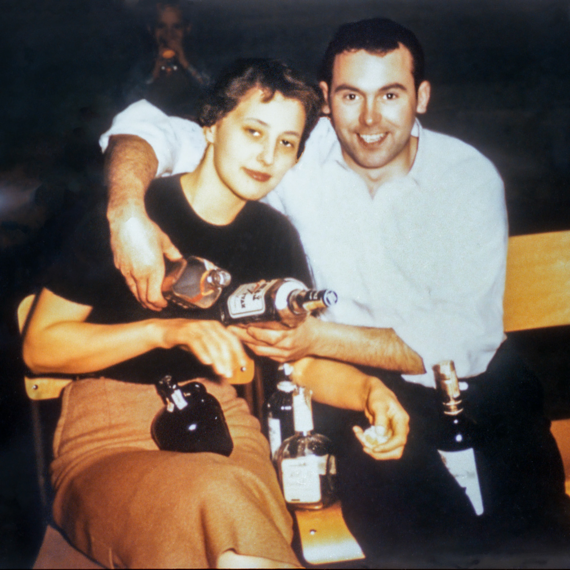 Jan 1958 • Kathleen [Shewchuk] Huculak puts up with a little bit of slap stick humour from husband John Huculak at a New Years Even party in Edmonton, Alberta