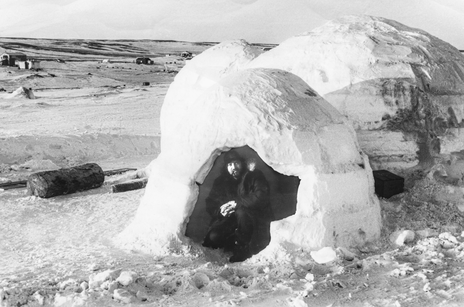 1969: Steve Shewchuk. Hand lettered caption on photo back: To: Brian (Huculak). Sacks Harbour, Banks Island, N.W.T.. An igloo - home of the eskimos. Love Uncle Steve 1969"