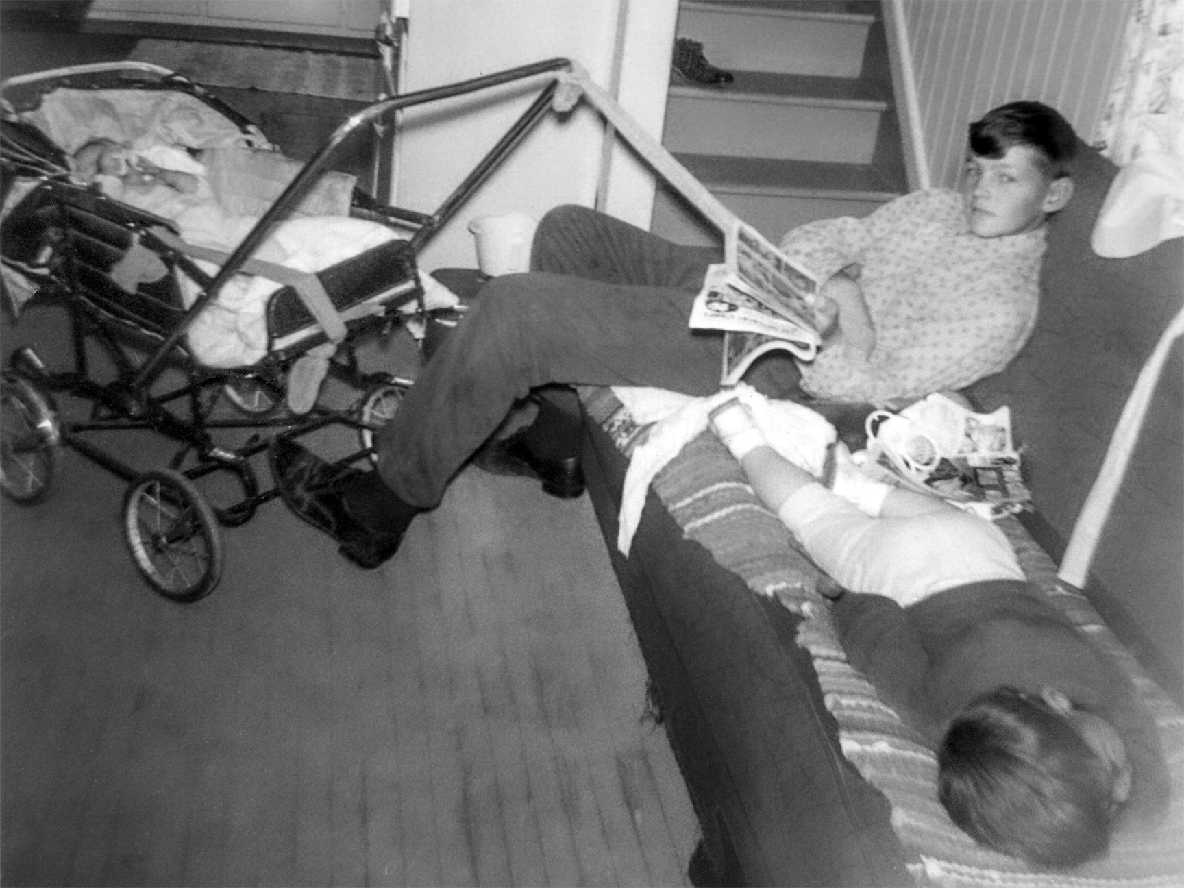 Circa 1968: Carl Tatarin baby sitting cousins on the family farm near Willingdon, AB. That's Brian Huculak snoozing on the couch.