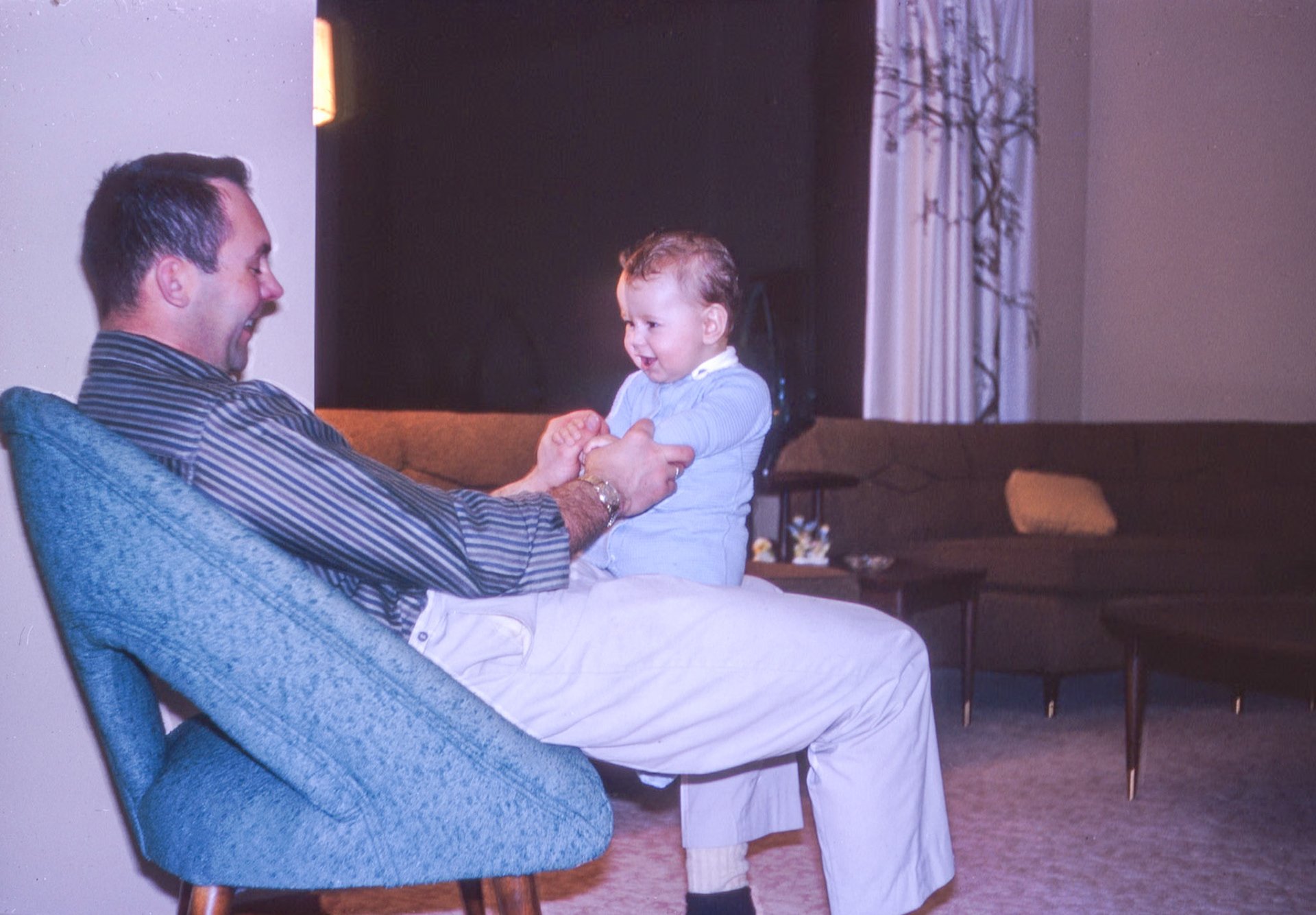 John Huculak (32) and son Brian Huculak (-1) at family home in Edmonton, AB, early 1965 or late 1964.Photo credit Kathleen Huculak.