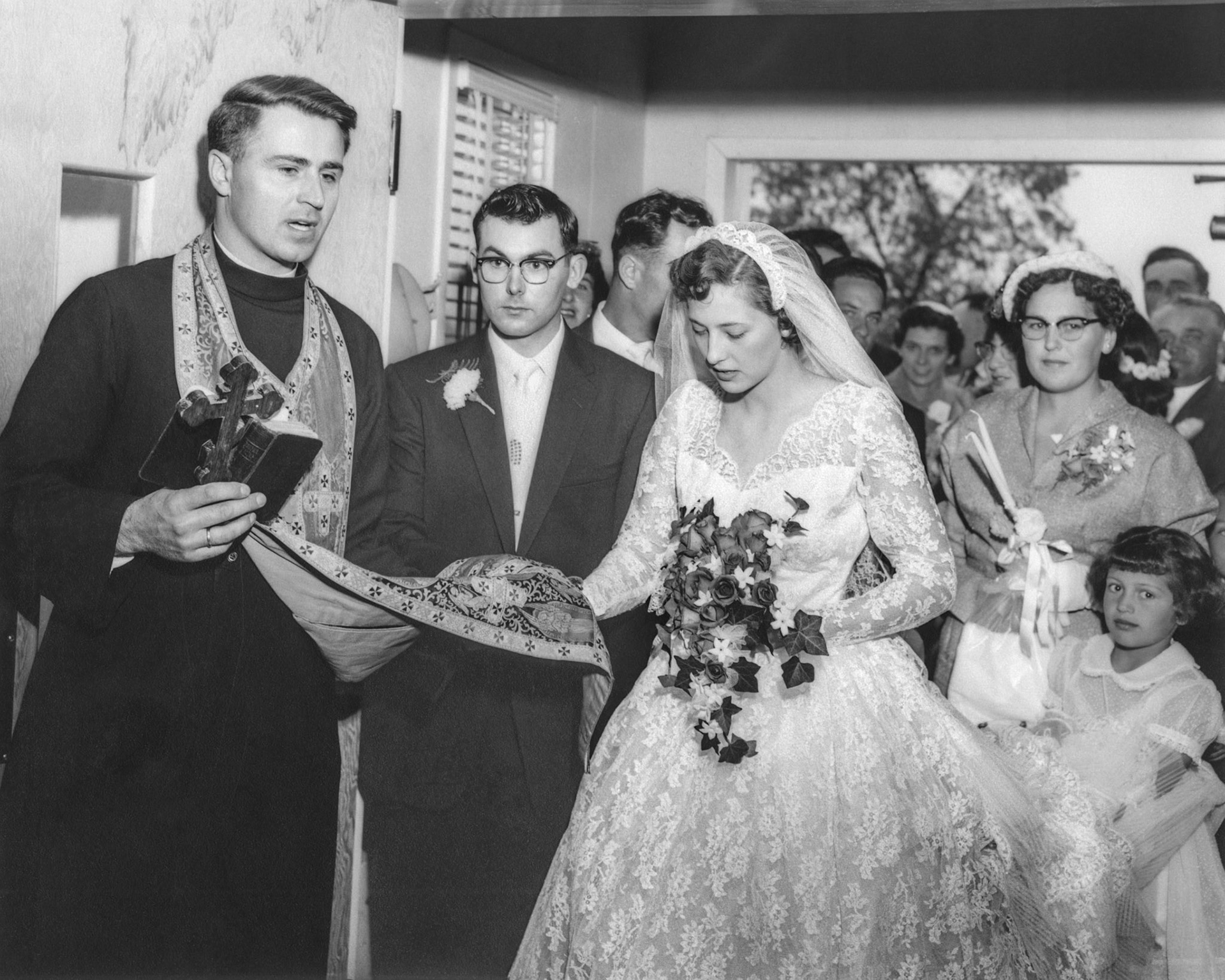L to R: Rev Dmytro Luchak, John Huculak, Kathleen Shewchuk. Flower girl bottom right Julia Megley, Maid of Honour Kathleen's sister Lena [Shewchuk] Tatarin.