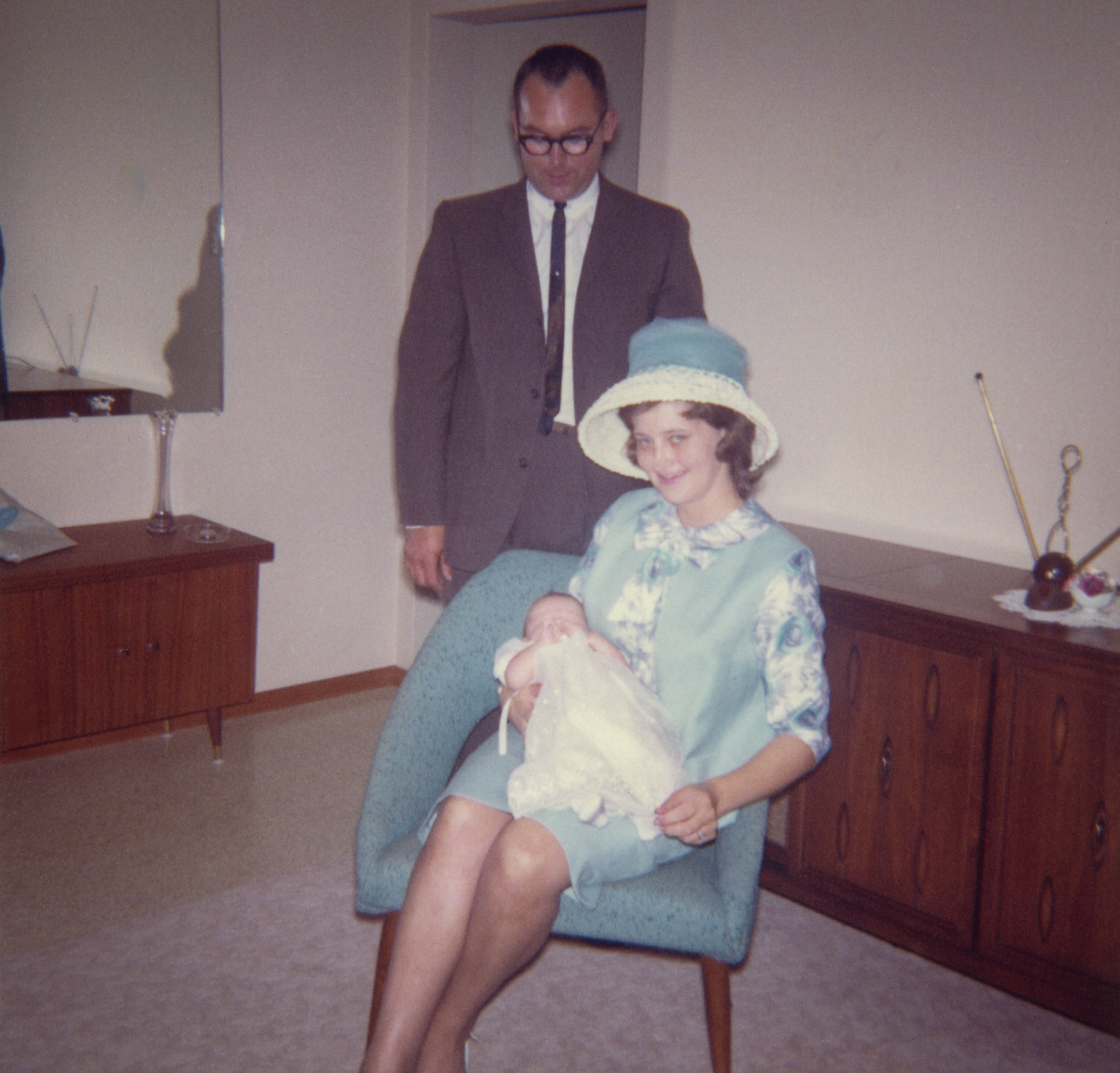 July 1964 • John Huculak and Kathleen [Shewchuk] Huculak with infant son Brian. Likely day of Brian's batism, location presumed to be Edmonton, AB.