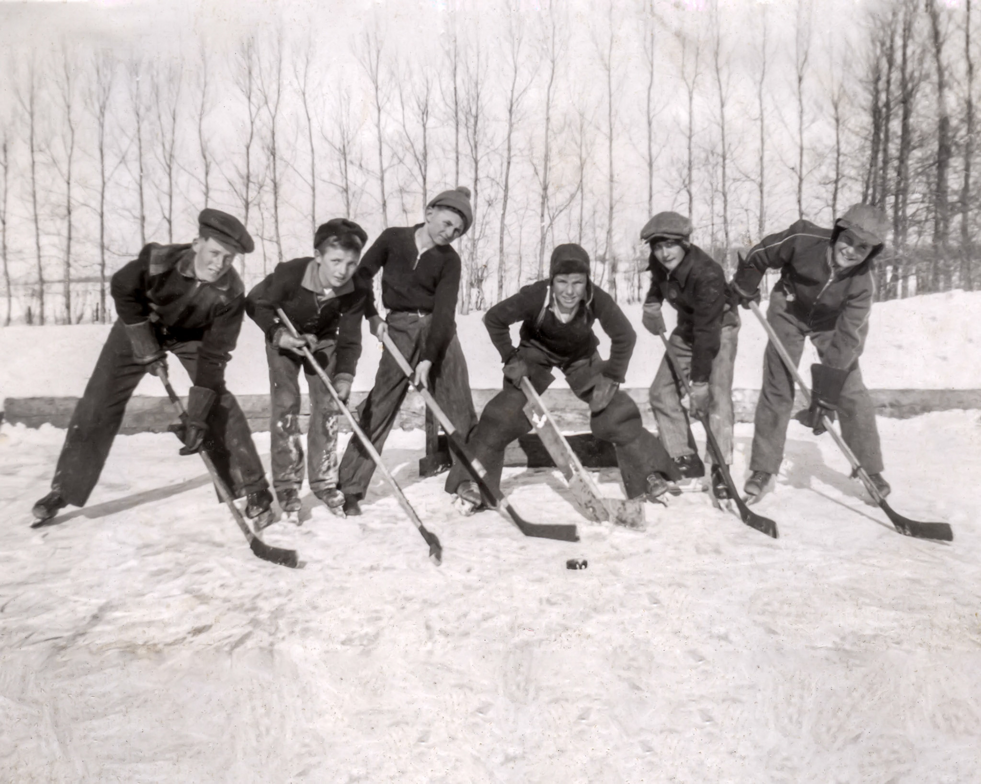 Looking for names of these young faces. 1941 vintage photo of the local Borowich School hockey team near Willingdon, Alberta. Faces and names unknown. Photo Credit: Unknown. Scan and Restoration from black and white print by Brian M Huculak