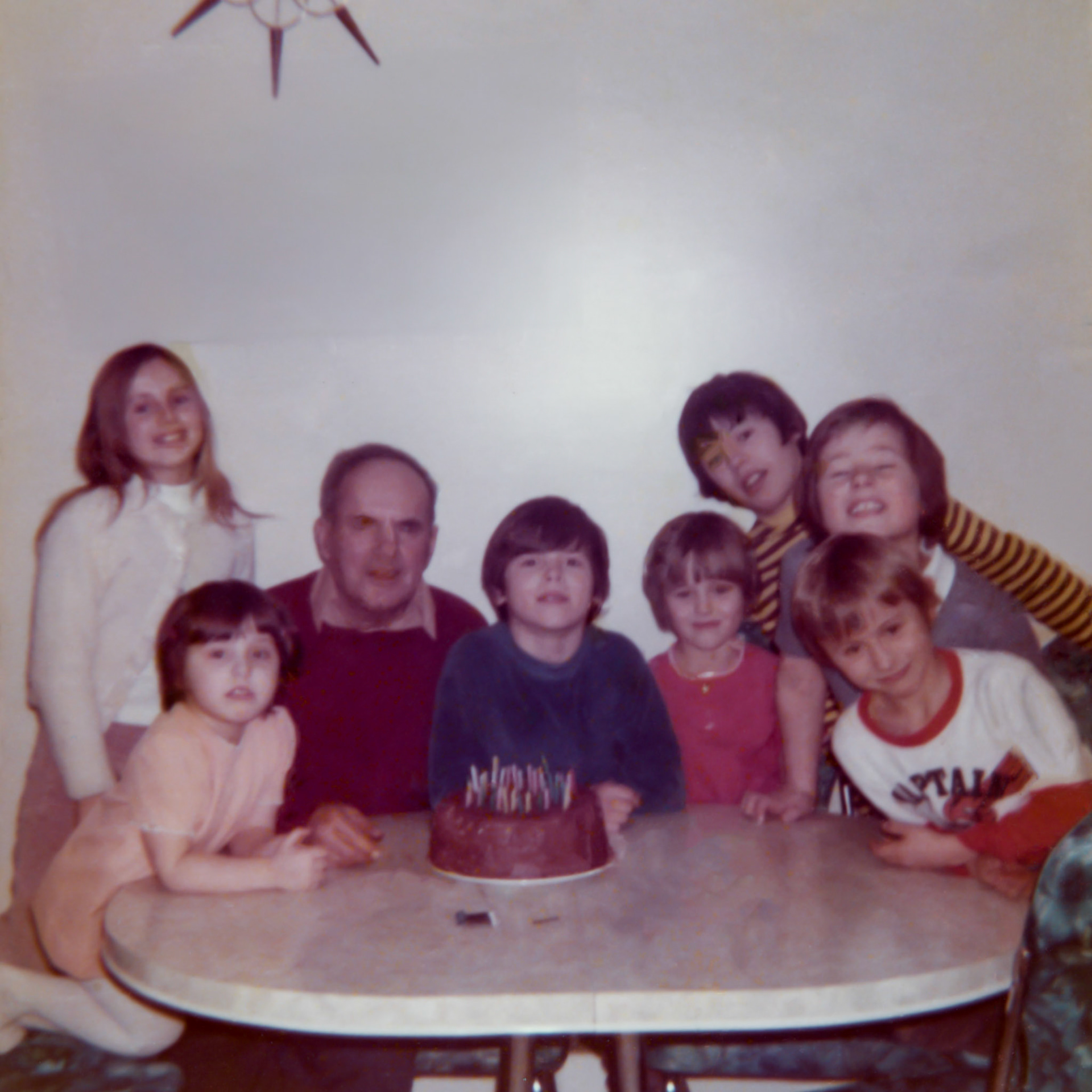 16 Dec 1973 • John Huculak SR 68th birthday w/grandchildren - family of George and Ricki Huculak, and John and Kathleen Huculak - Edmonton, AB. L to R Kelly • Sherri • John • Trevor • Lee-Ann • Ken • Brian • Wayne. Photo Credit: Unknown. Likely Kathleen Huculak.