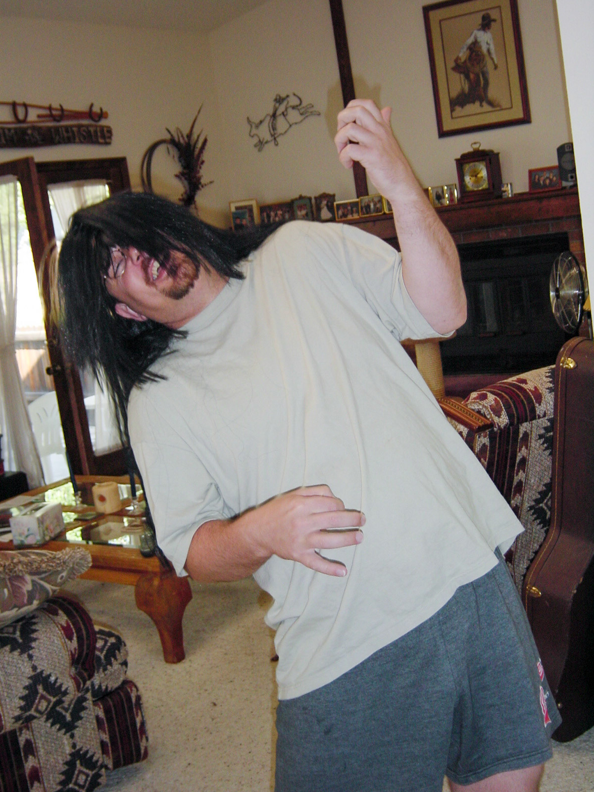 18 Aug 2001: Brian Huculak rocking the air guitar, Aurora, Colorado. Photo credit: Paula Rosson
