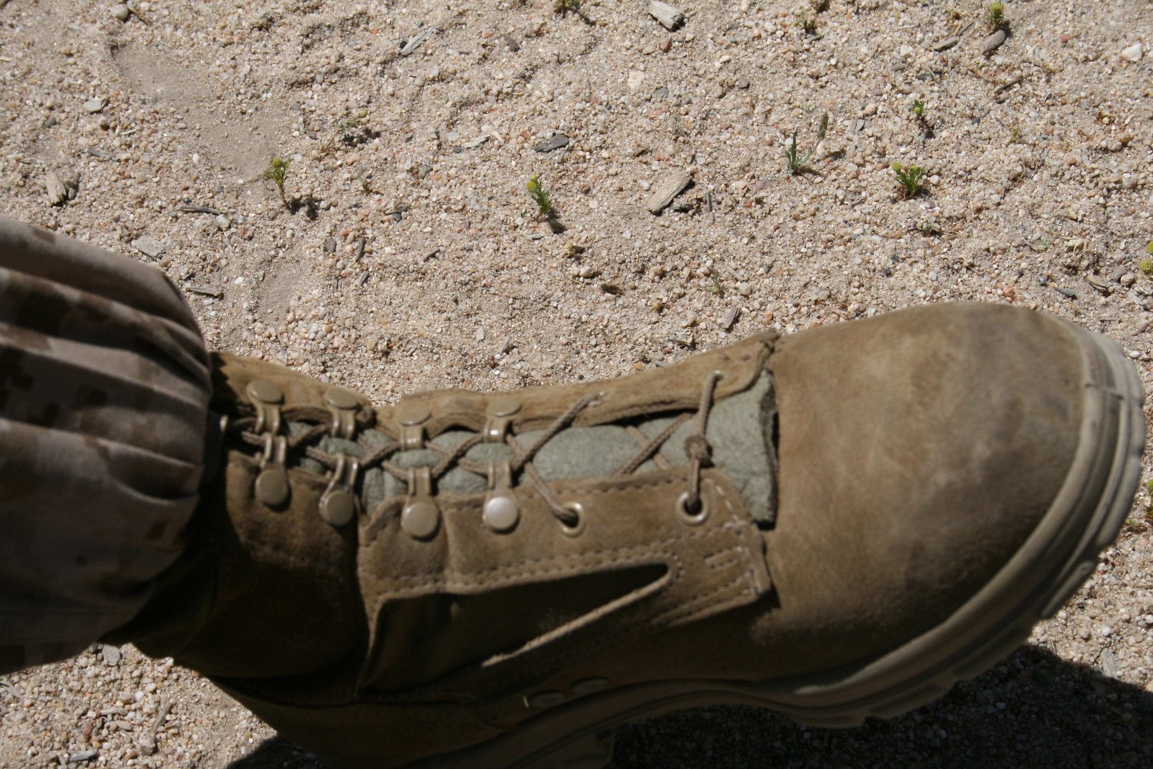 One soldier shared a common problem that was hard to fix in the field. Standard issued laces were too long and became uneven over time. He solved it by tying a knot in the middle of the laces to prevent them from shifting to one side. We thought this solution simple, effective and easy to incorporate.