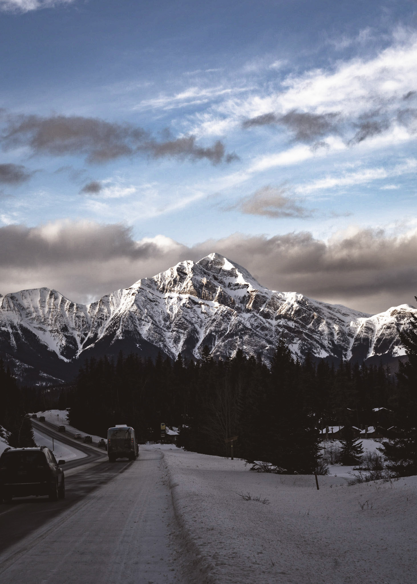The daily pilgrimage from Marmot Basin framed by the beautiful sunset light on Pyramid Mountain.