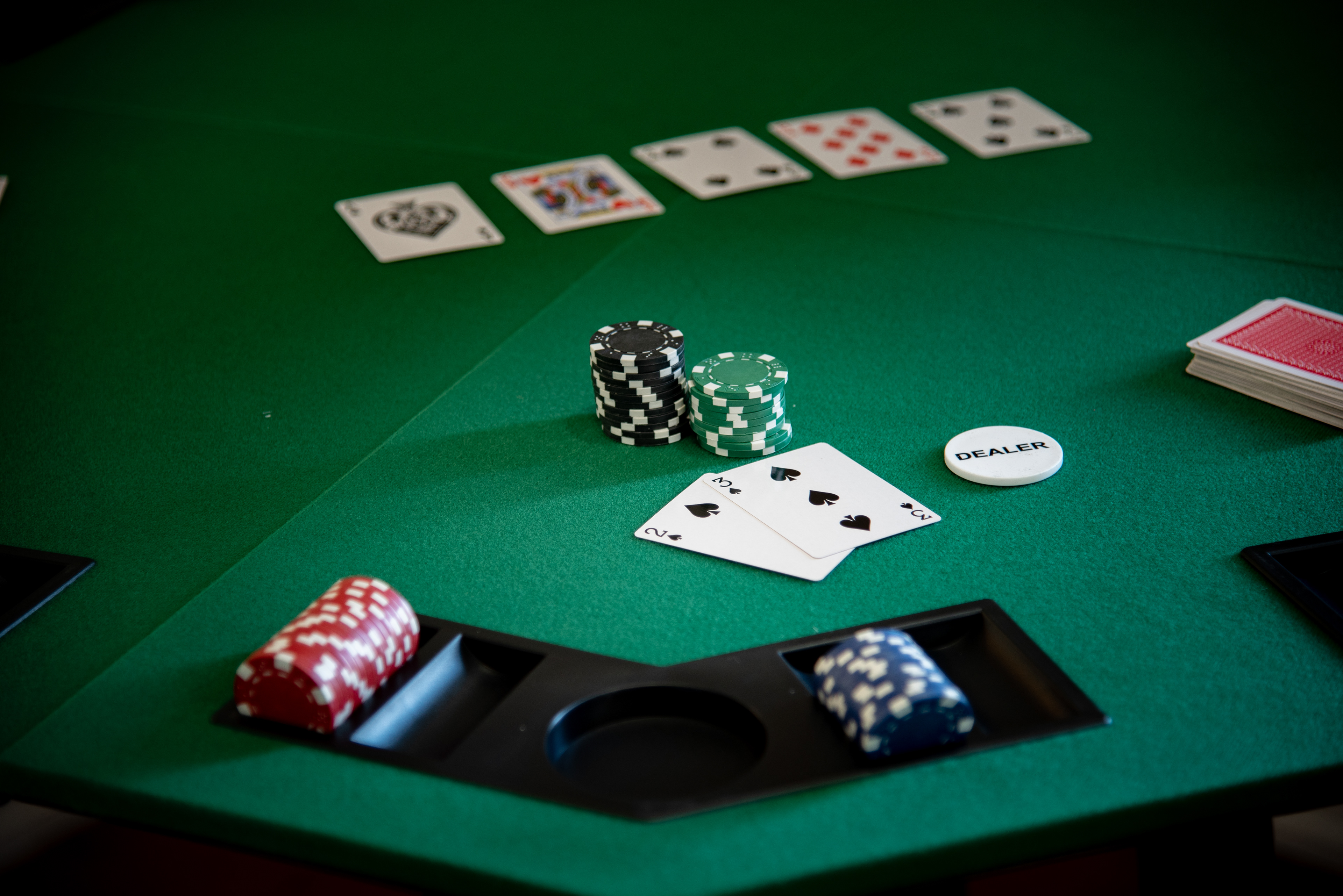 Poker table detail with cards and chips