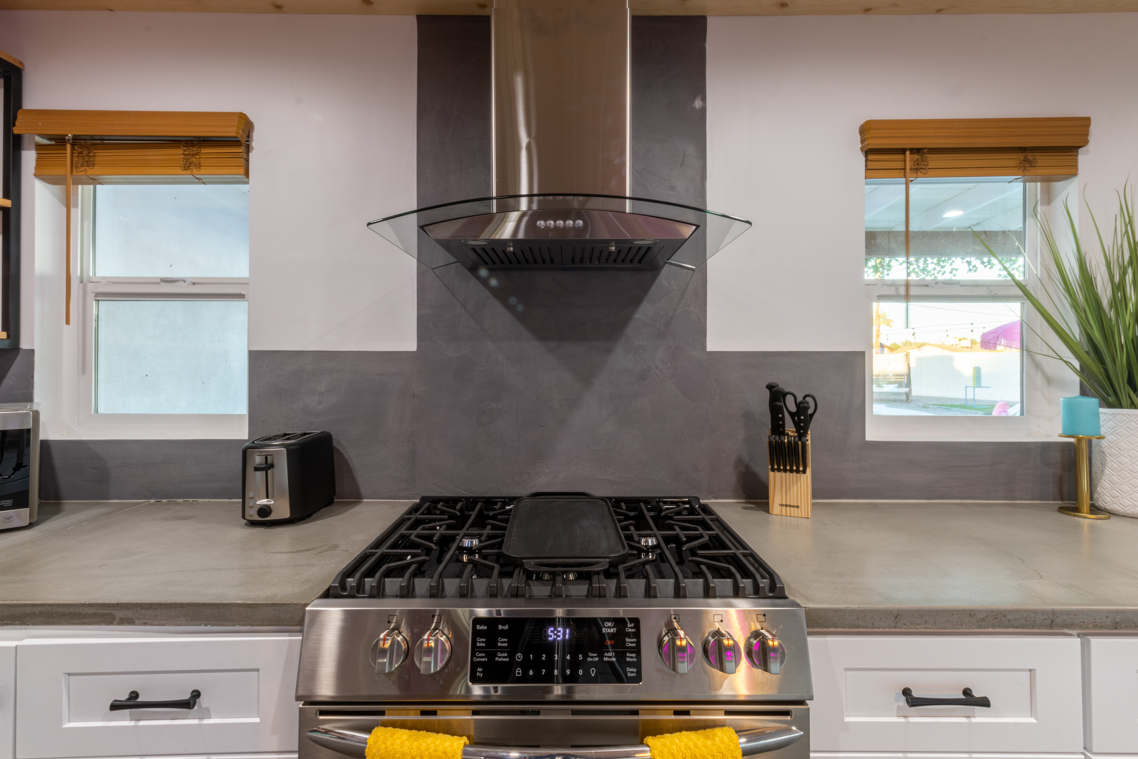 Kitchen range with stainless hood