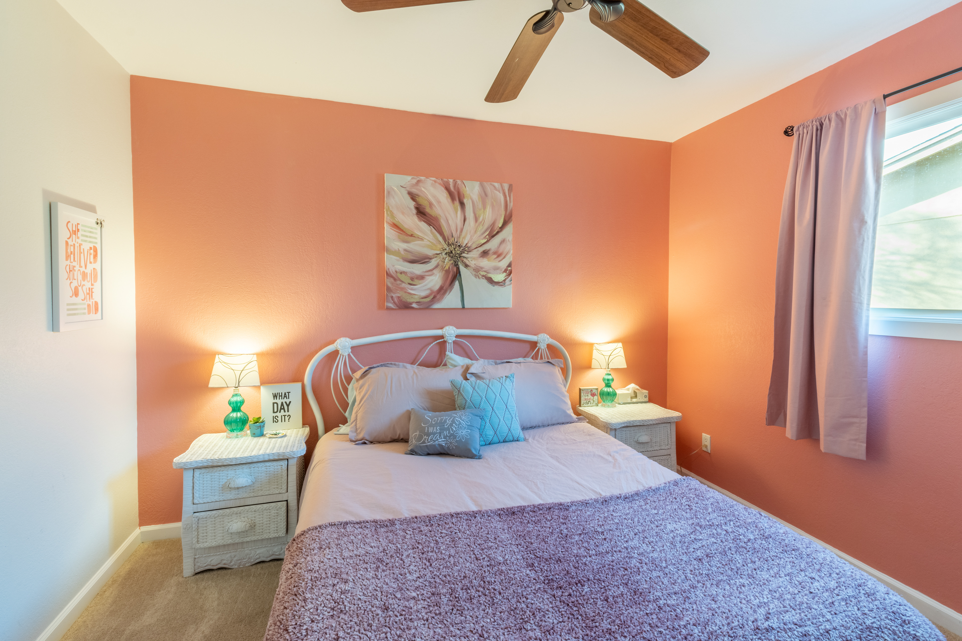 Bedroom with coral accent wall