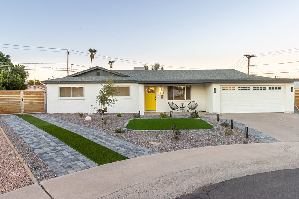 Front exterior of a single-story home at dusk