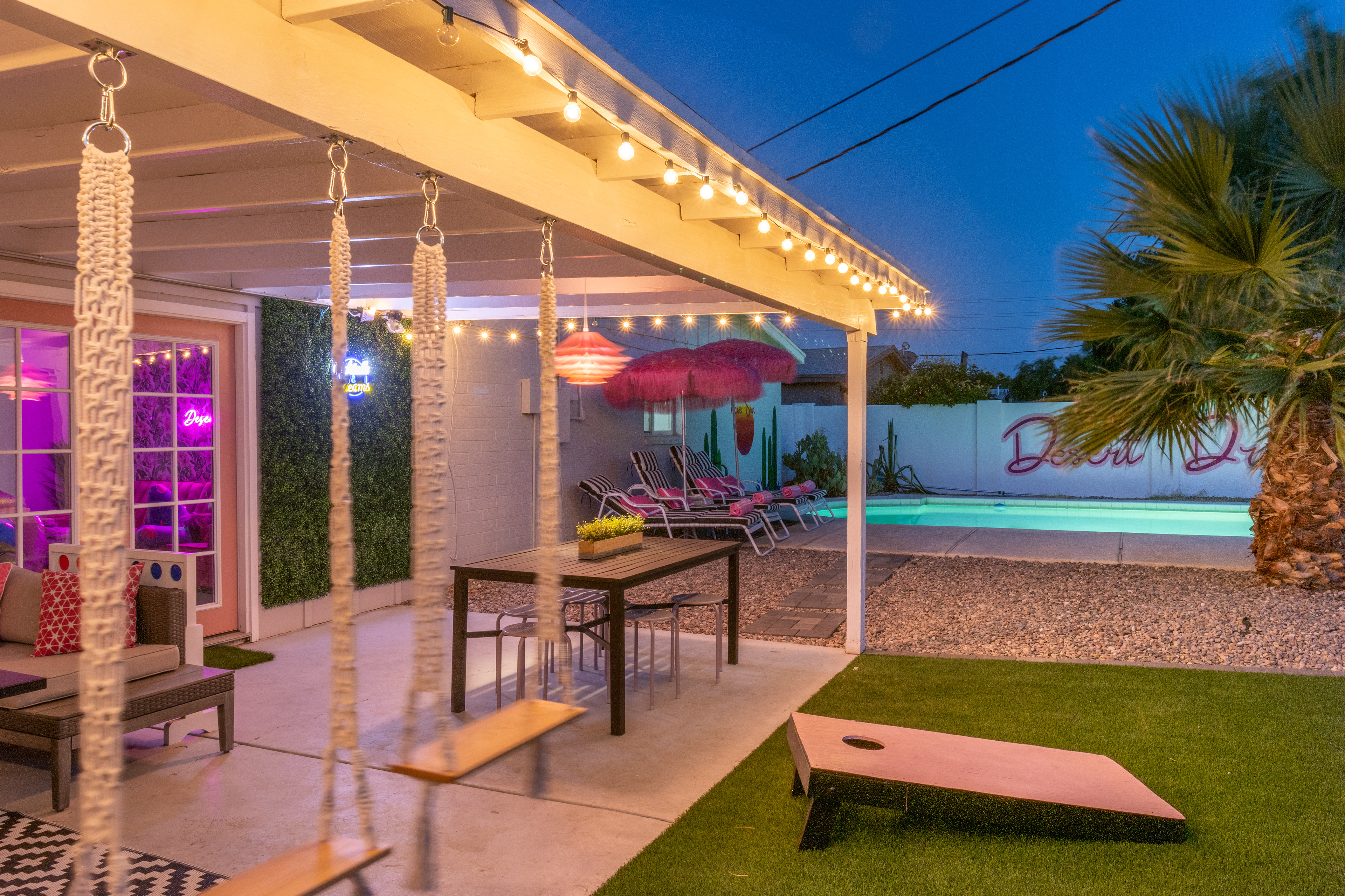Patio and cornhole at dusk